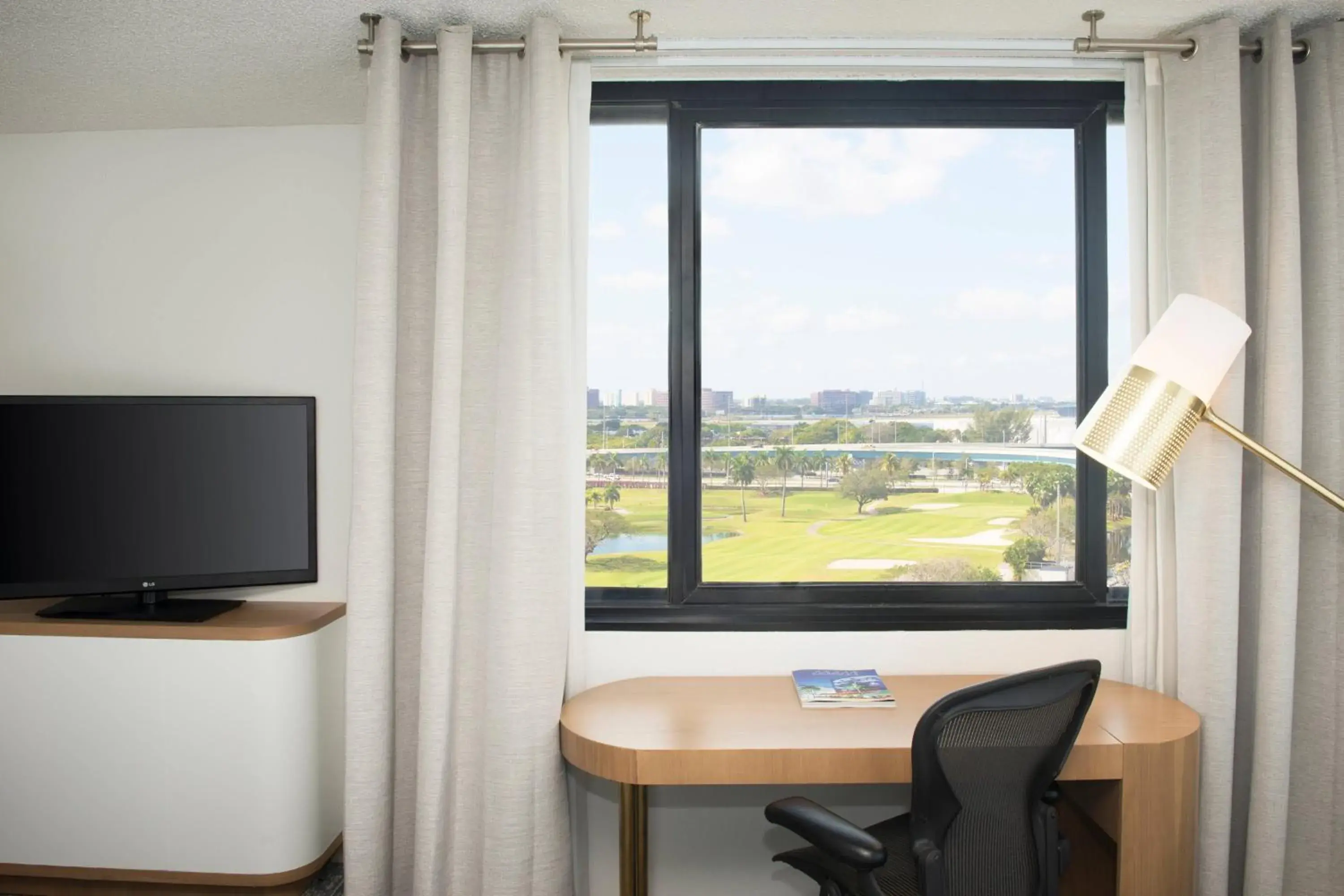 Traditional Queen Room with Two Queen Beds, City View and Roll-in Shower - Mobility Accessible in Sheraton Miami Airport Hotel and Executive Meeting Center Traditional Queen Room with Two Queen Beds, City View and Roll-in Shower - Mobility Accessible in Sheraton Miami Airport Hotel and Executive Meeting Center