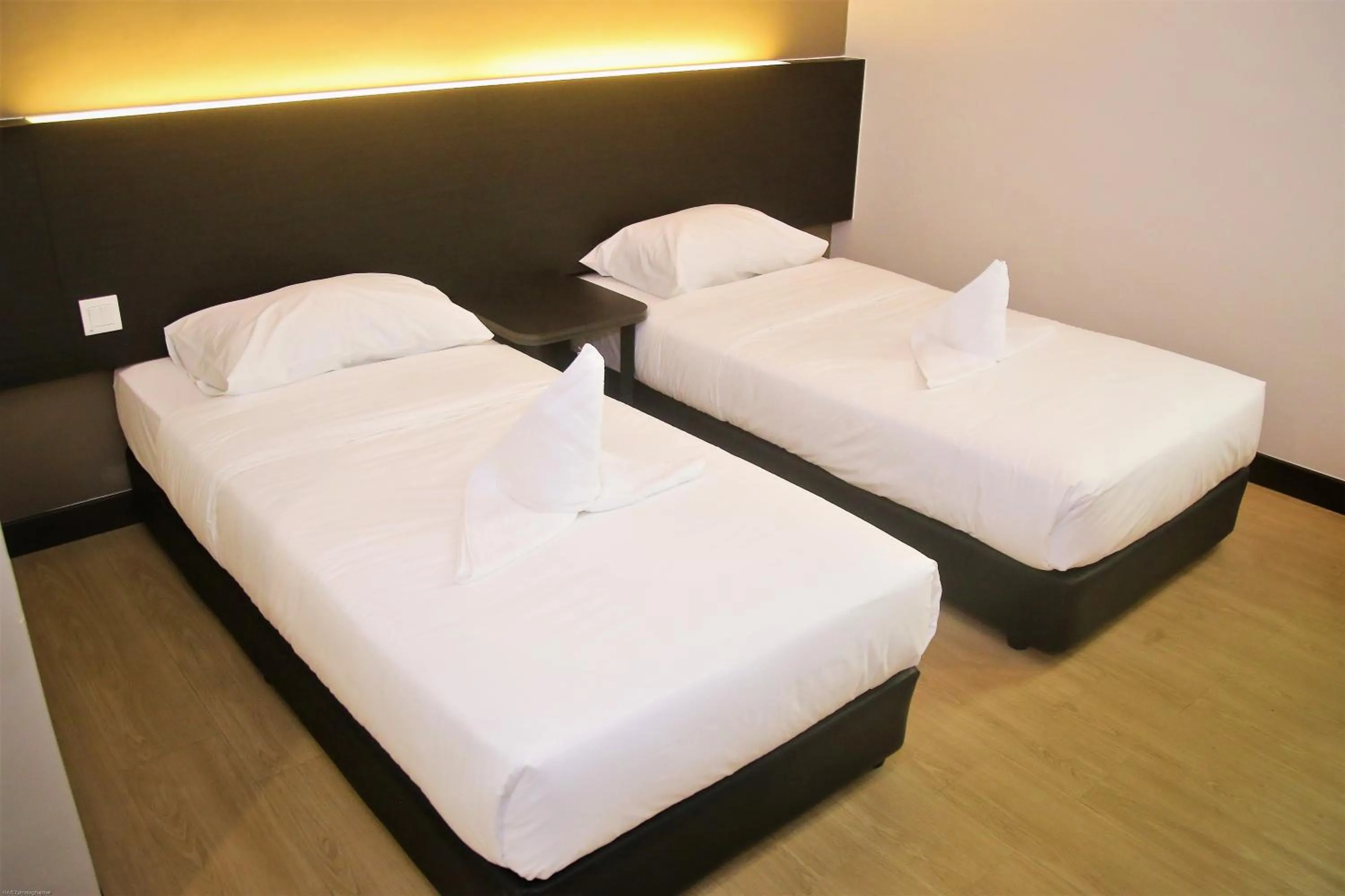 Bed in PADI PADI HOTEL