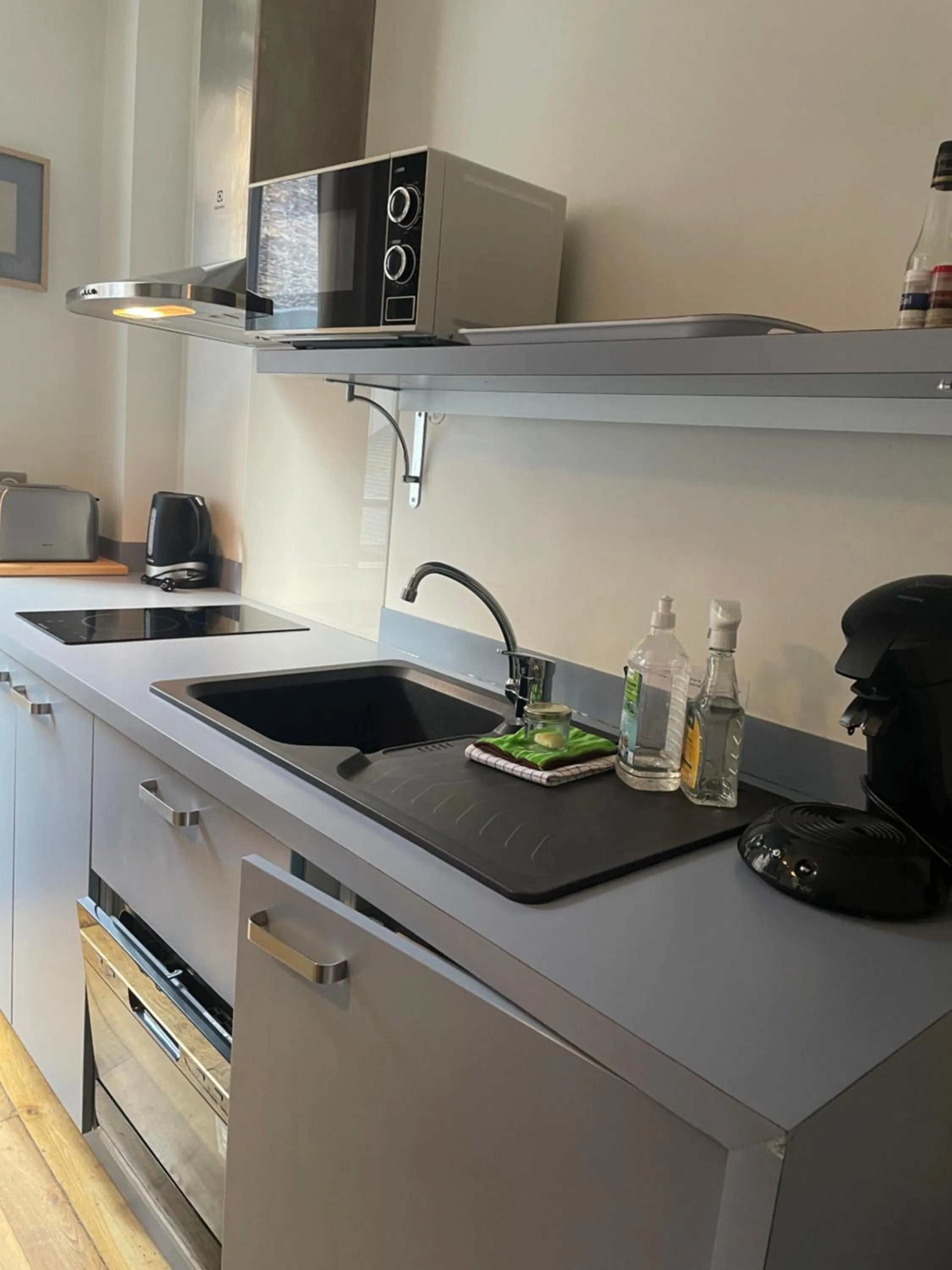 Kitchen or kitchenette in Garden Hotel Rennes Centre Gare