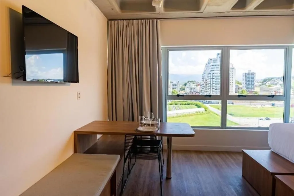 Bedroom in Atrium Studios by Xtay - Conforto em Palhoça, a poucos metros da praia