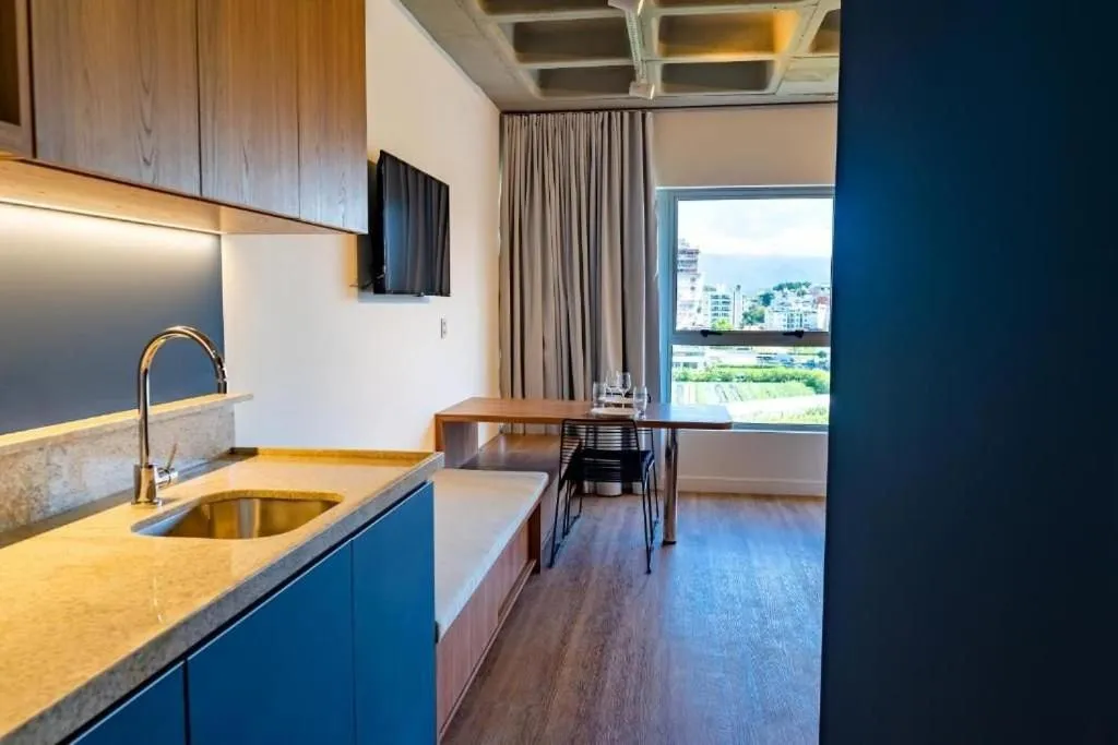 Bedroom in Atrium Studios by Xtay - Conforto em Palhoça, a poucos metros da praia