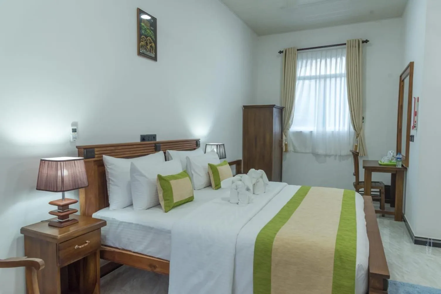 Bed in L S Lanka Hotel Dambulla