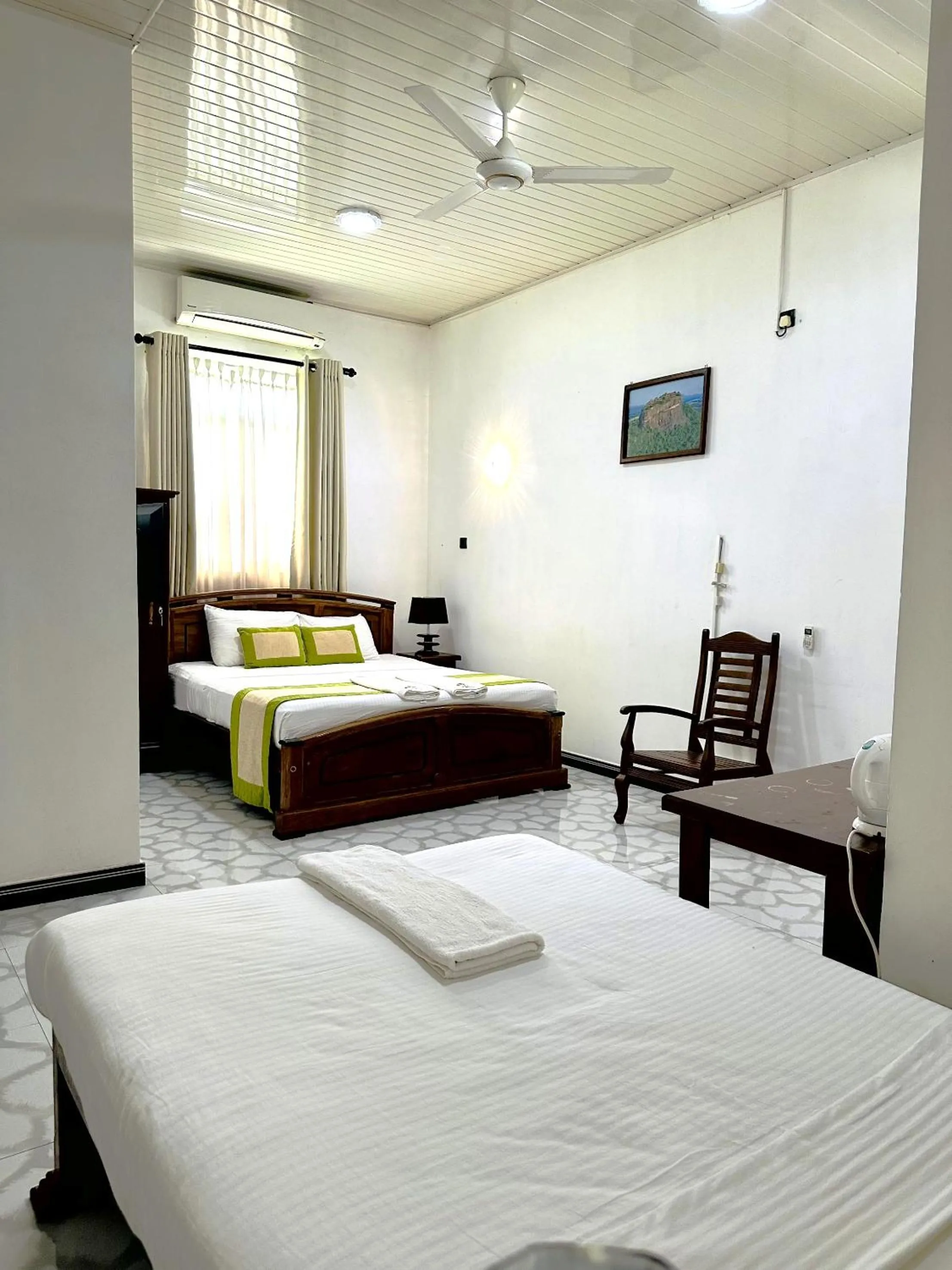 Bed in L S Lanka Hotel Dambulla