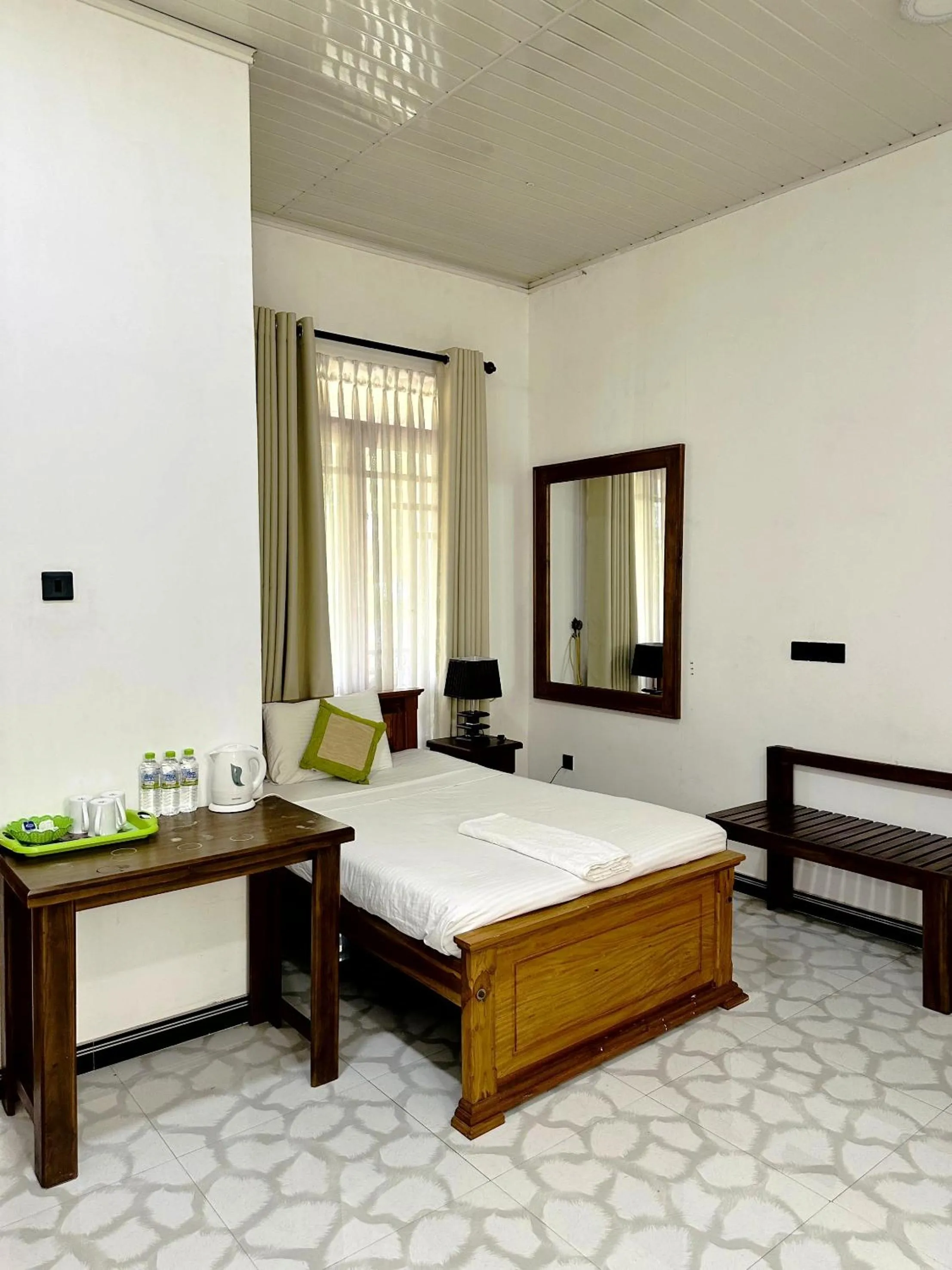 Bed in L S Lanka Hotel Dambulla