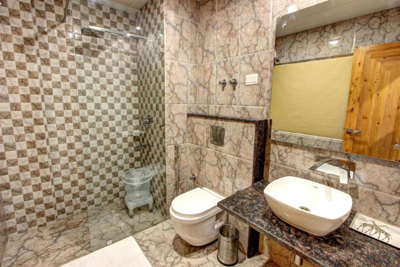 Bathroom in Regenta Place Green Leaf Manali- A Centrally Heated Resort