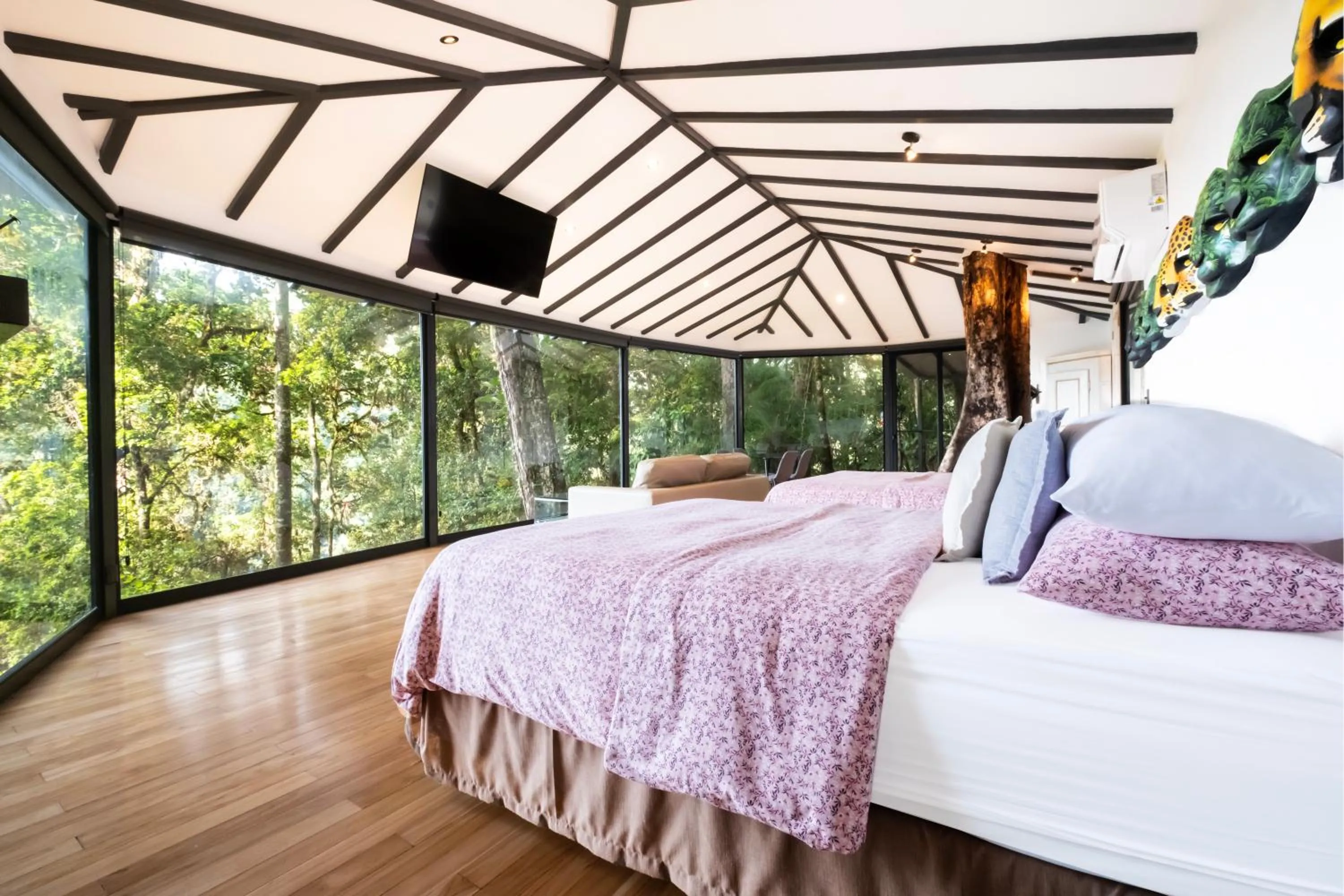 Bed in Dantica Cloud Forest Lodge