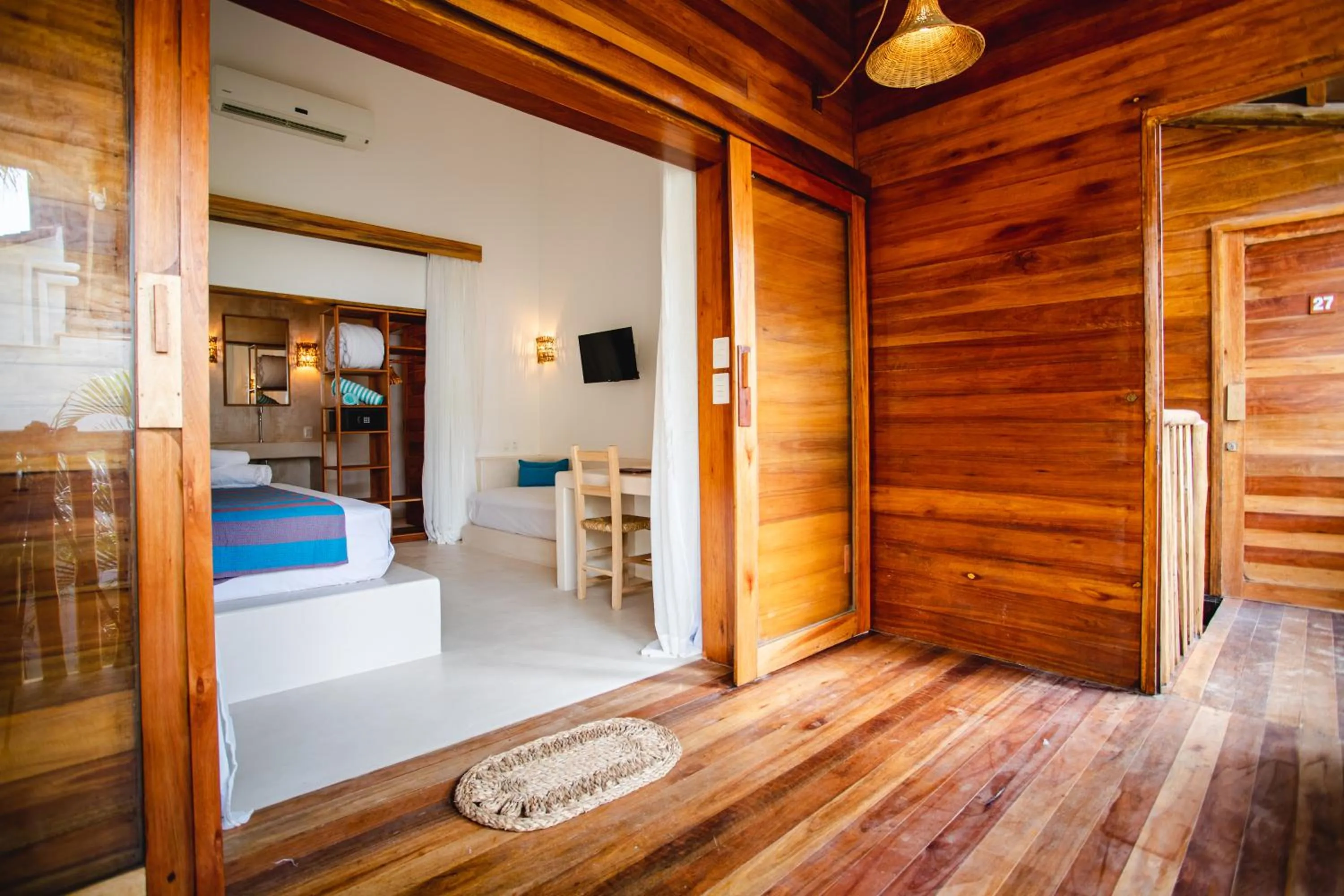 Communal lounge/ TV room, Bed in Café Jeri Hotel - Adults Only