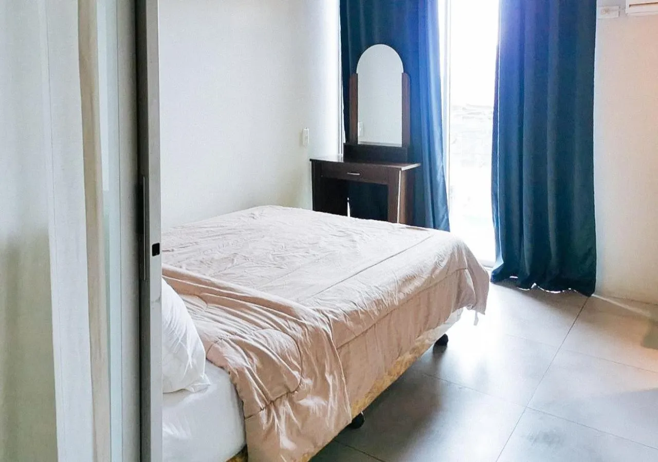 Bedroom in GMRENTALS Apartment at Mactan Airport