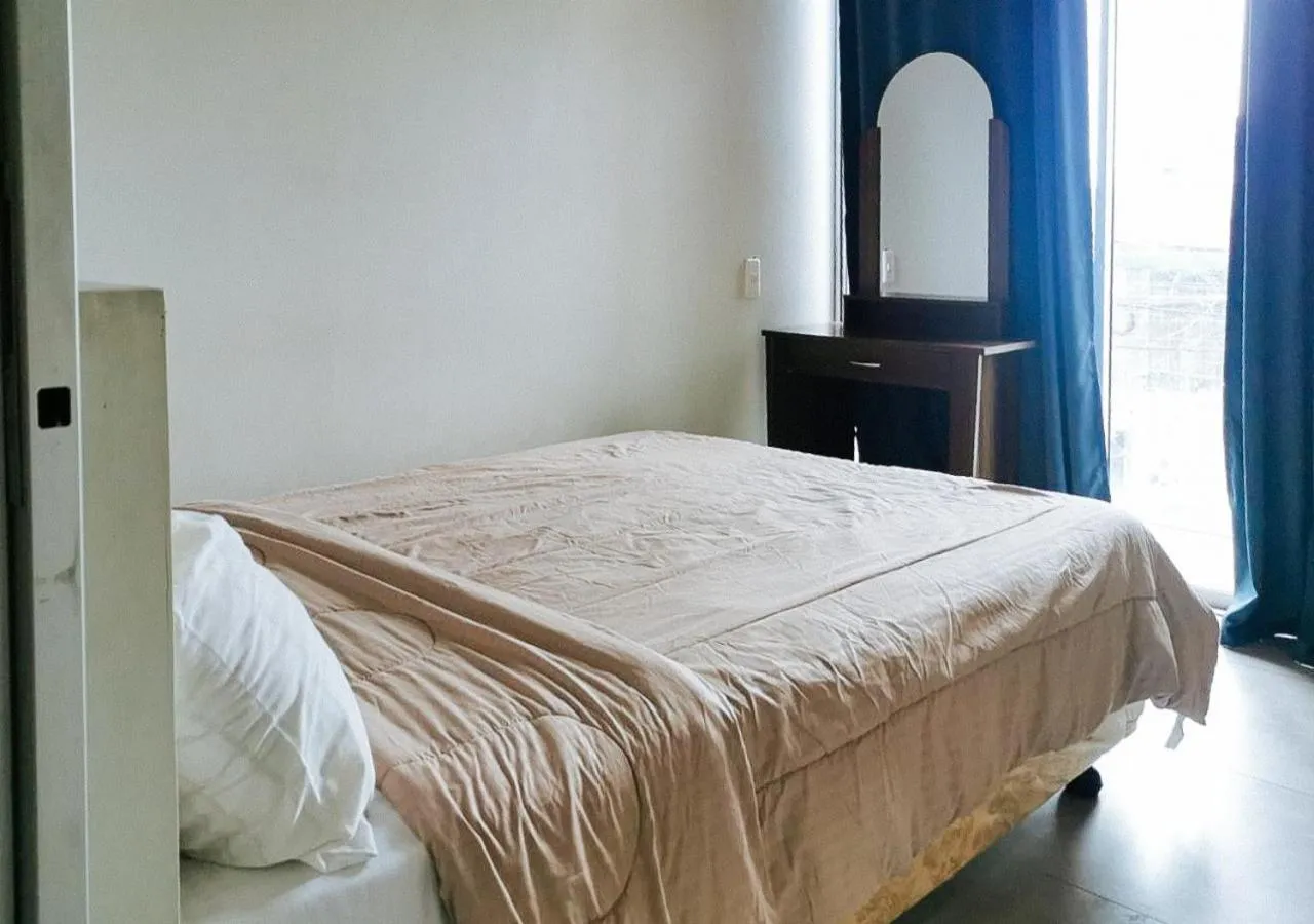 Bedroom in GMRENTALS Apartment at Mactan Airport
