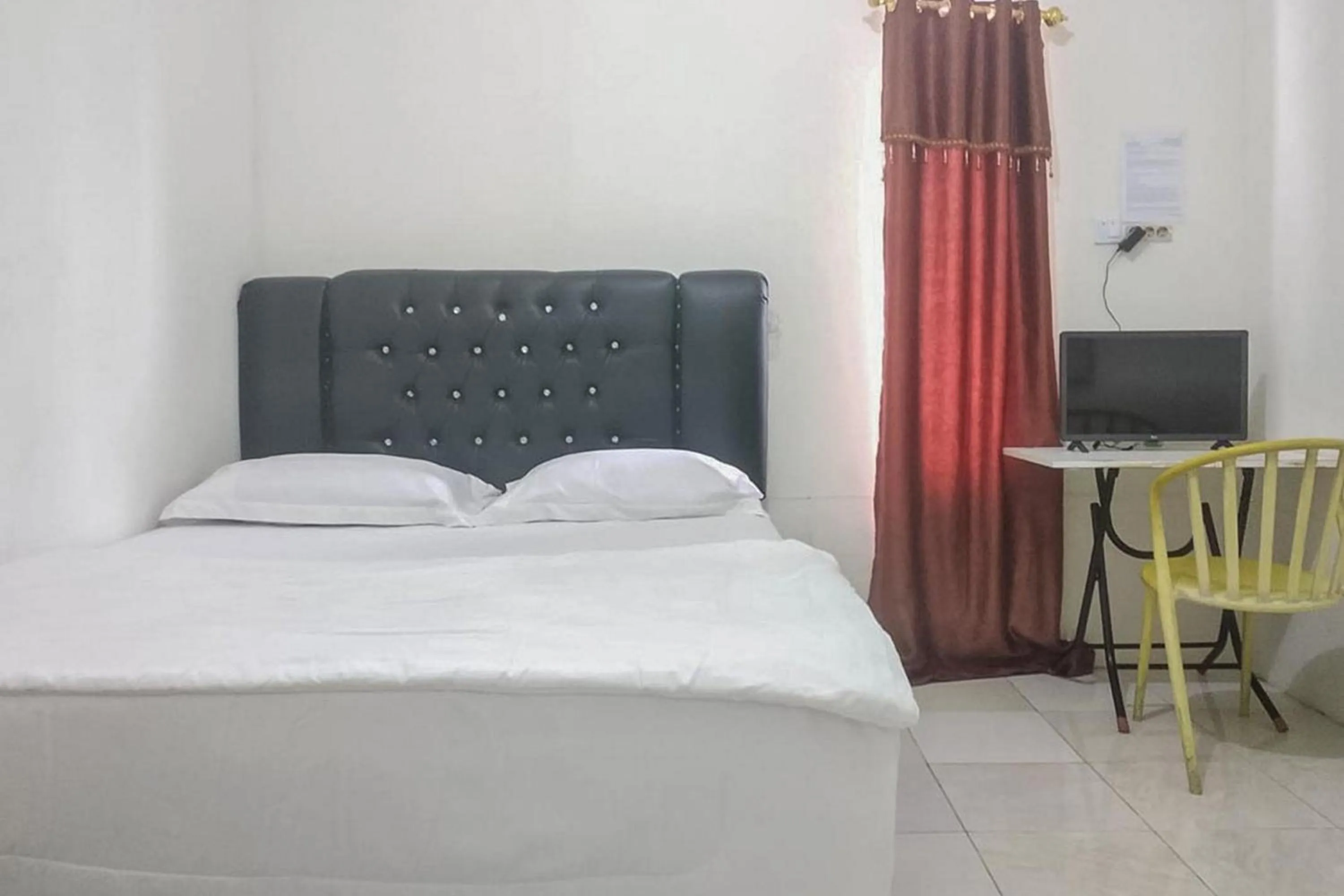 Bed in Nayla Homestay Jambi Mitra RedDoorz