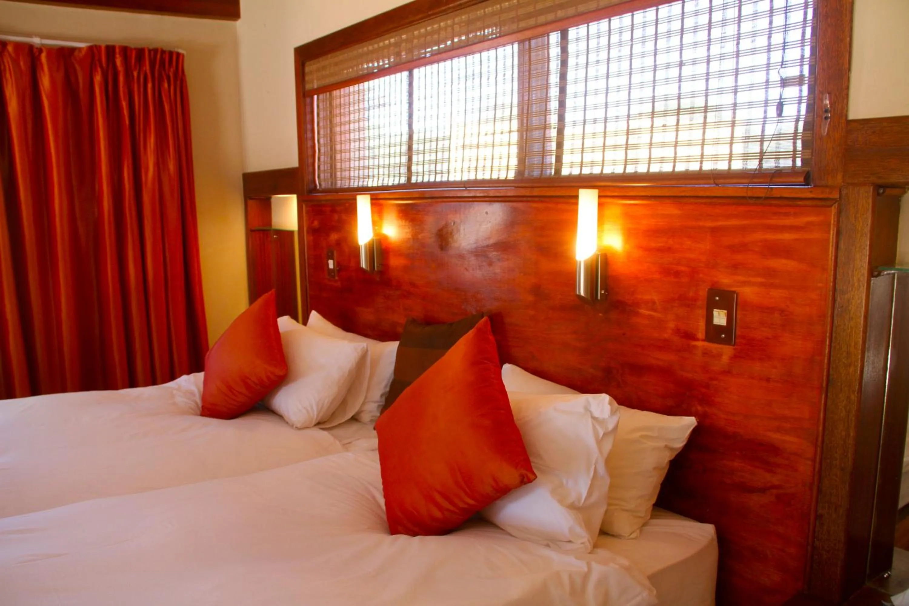 Bed in Zebra Kalahari Lodge