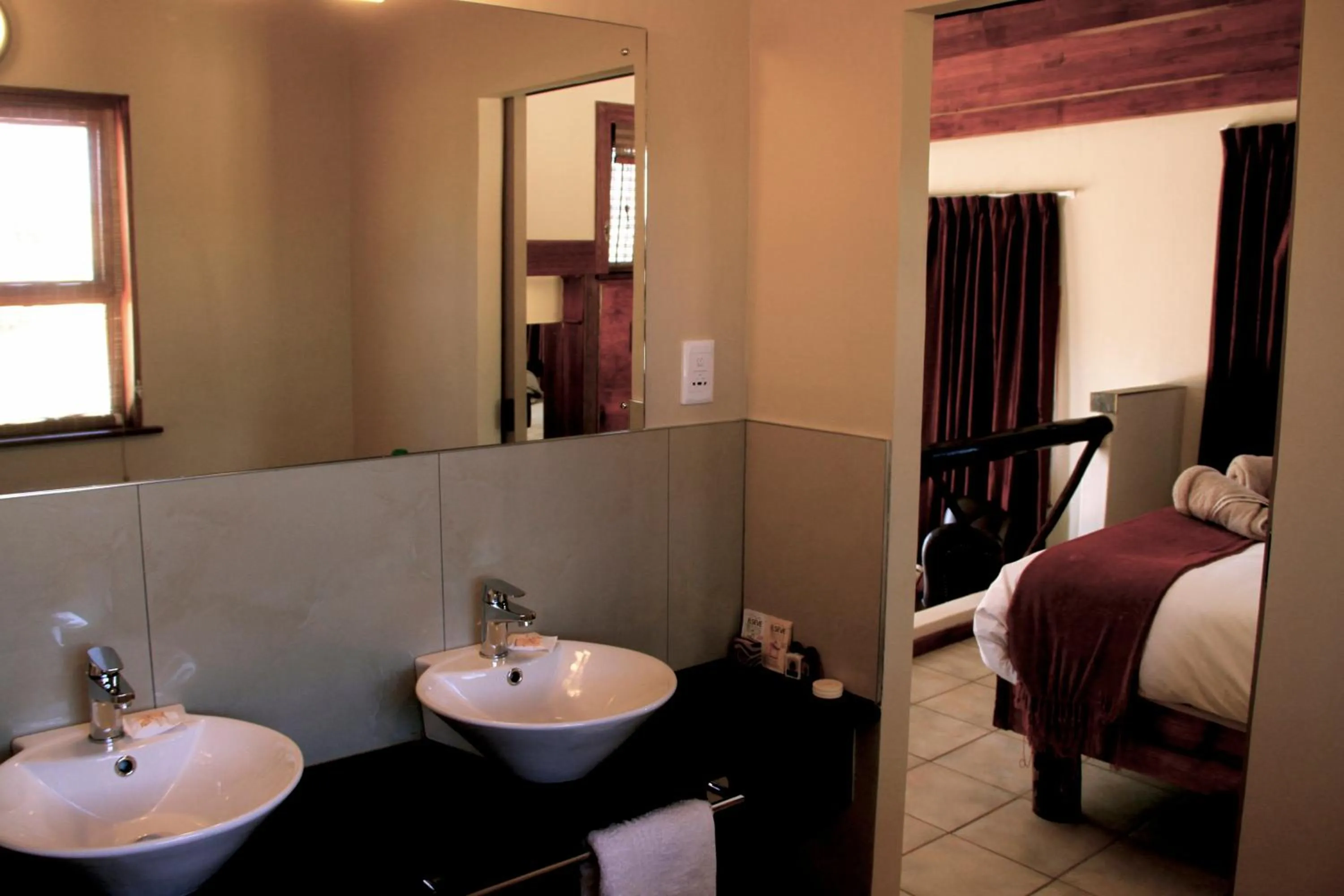 Bed in Zebra Kalahari Lodge