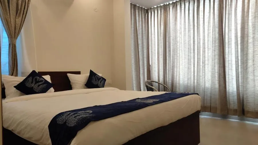 Bed in Hotel Amulya Fine Dine