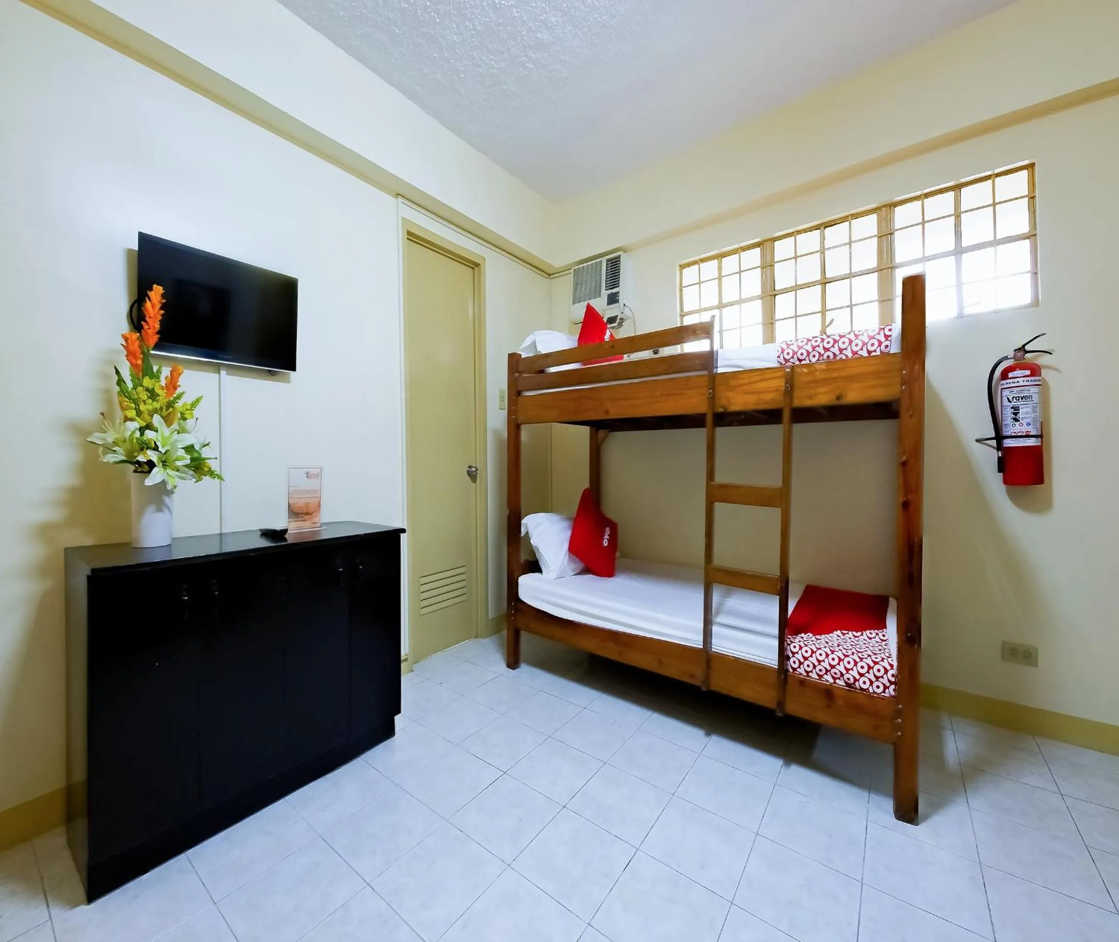 Bedroom in OYO 840 Orangenest Apartelle