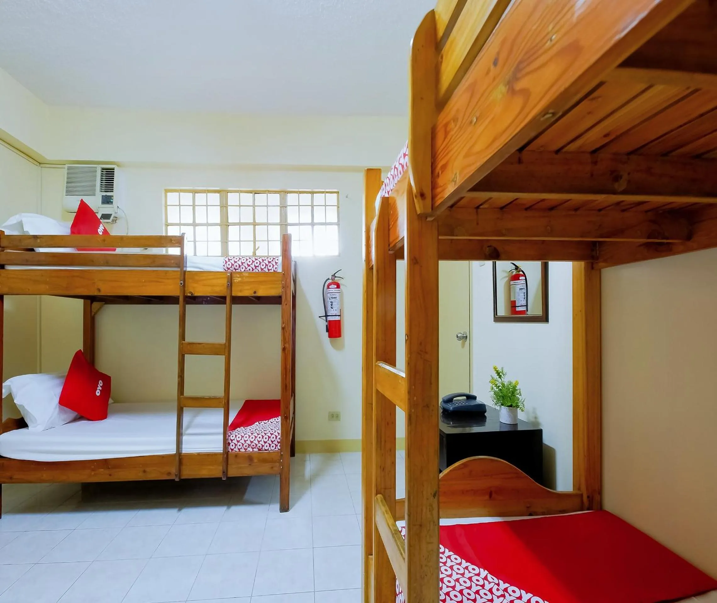 Bedroom in OYO 840 Orangenest Apartelle