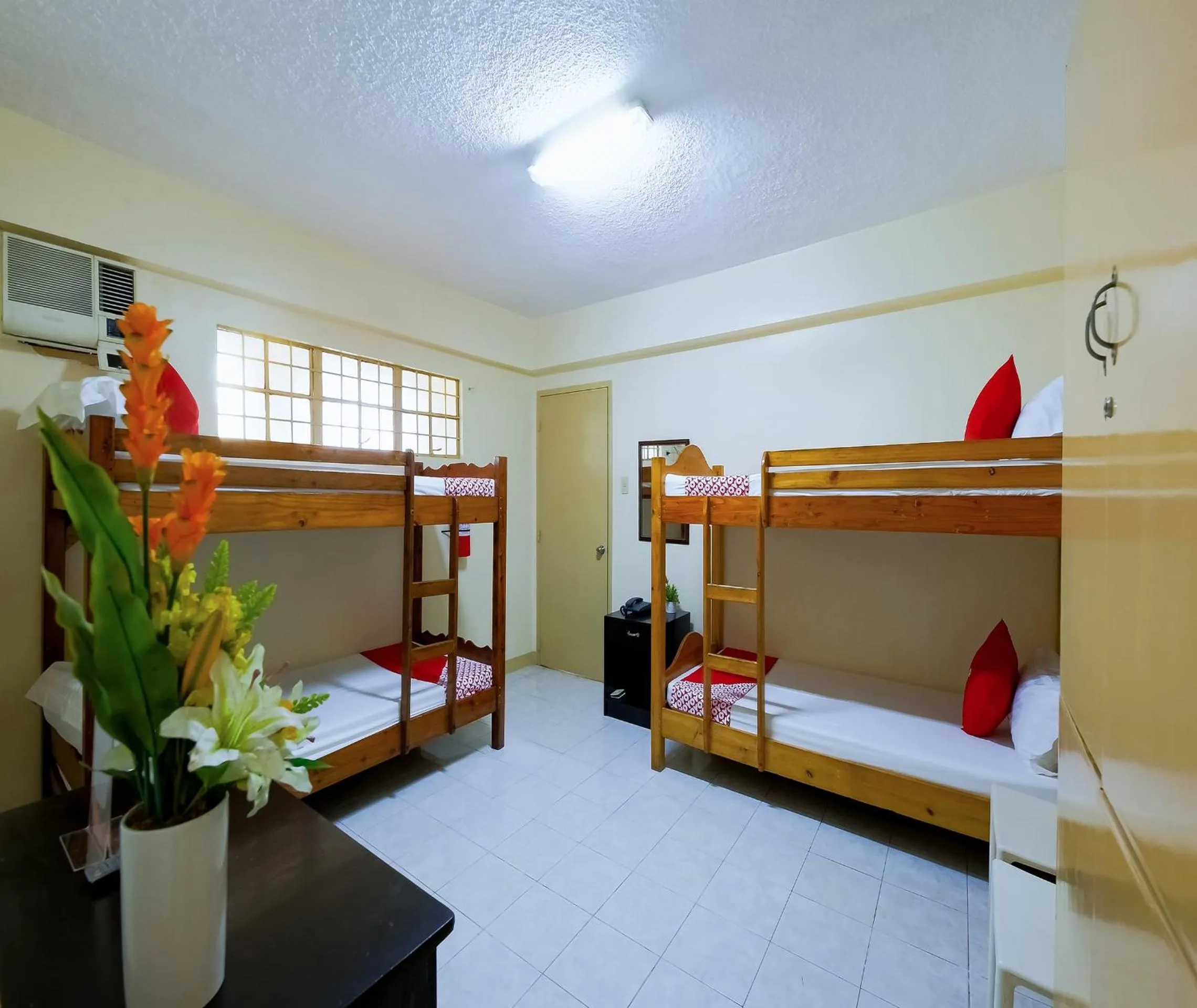 Bedroom in OYO 840 Orangenest Apartelle