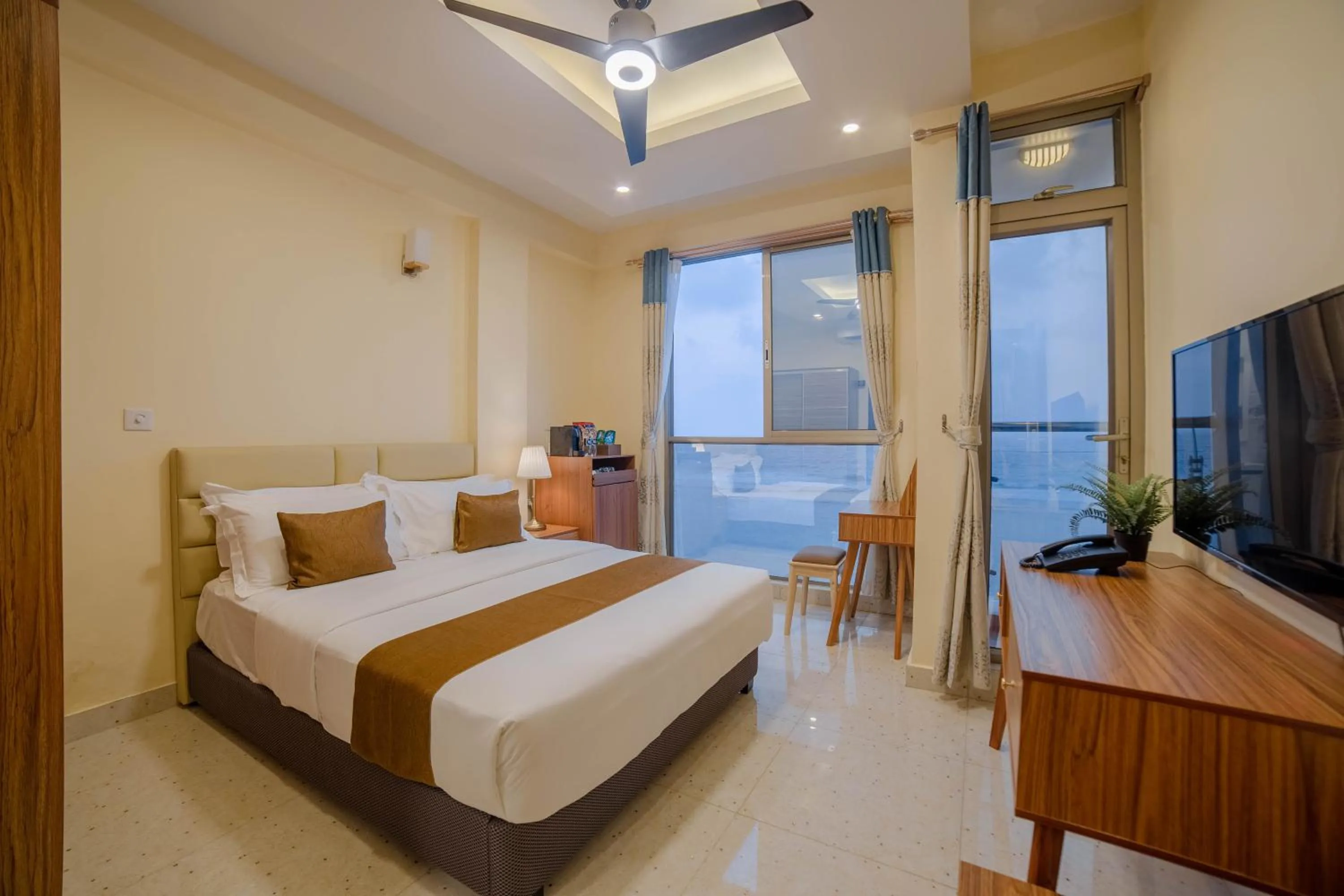 Balcony/Terrace, Bed in Amber Beach Hotel at Hulhumale