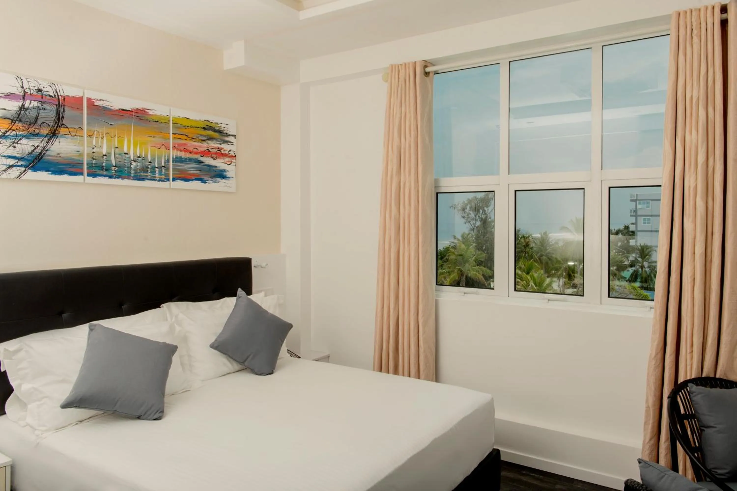 Bed in Acacia Beach Hotel