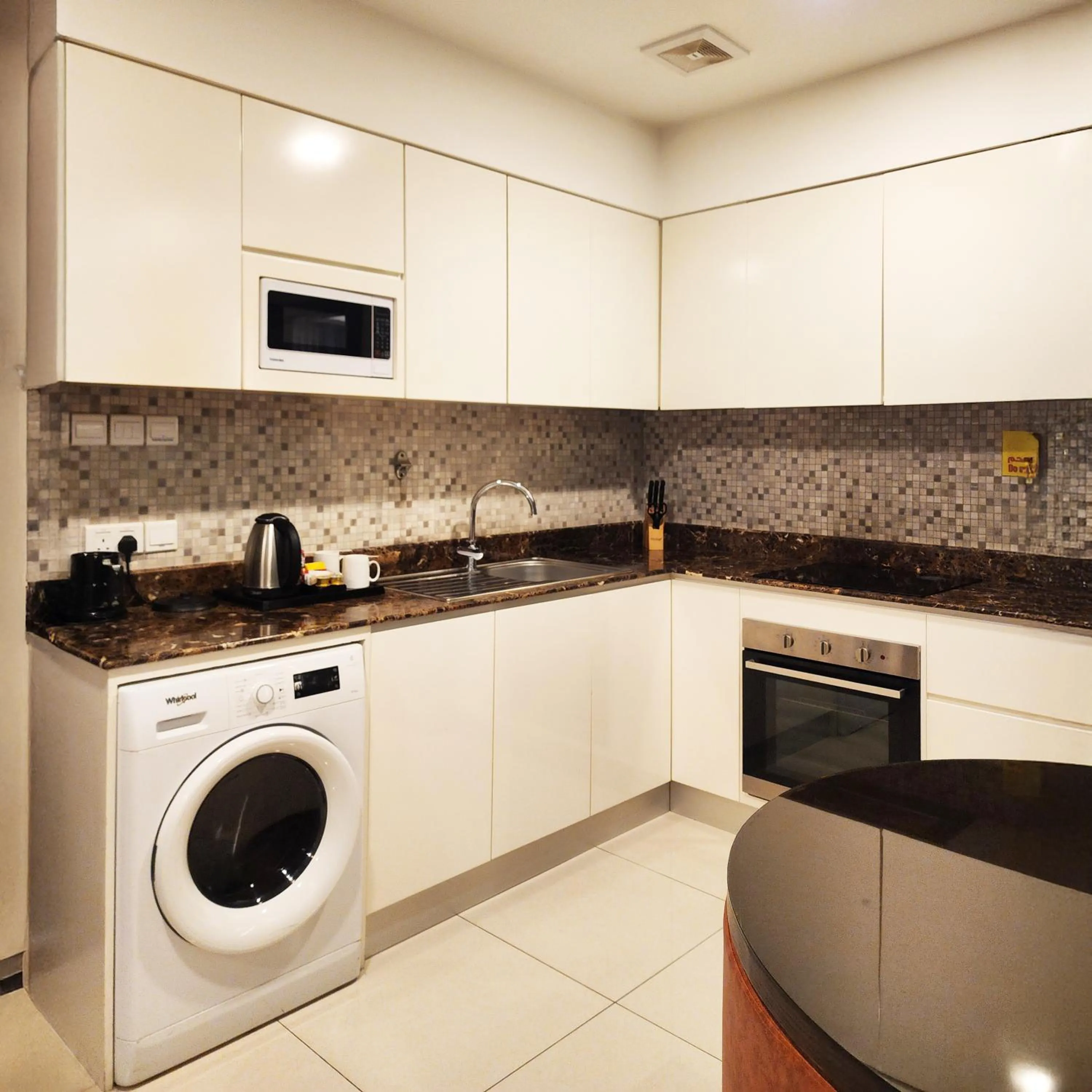 Kitchen or kitchenette in JUFFAIR BOULEVARD HOTEL & SUITES