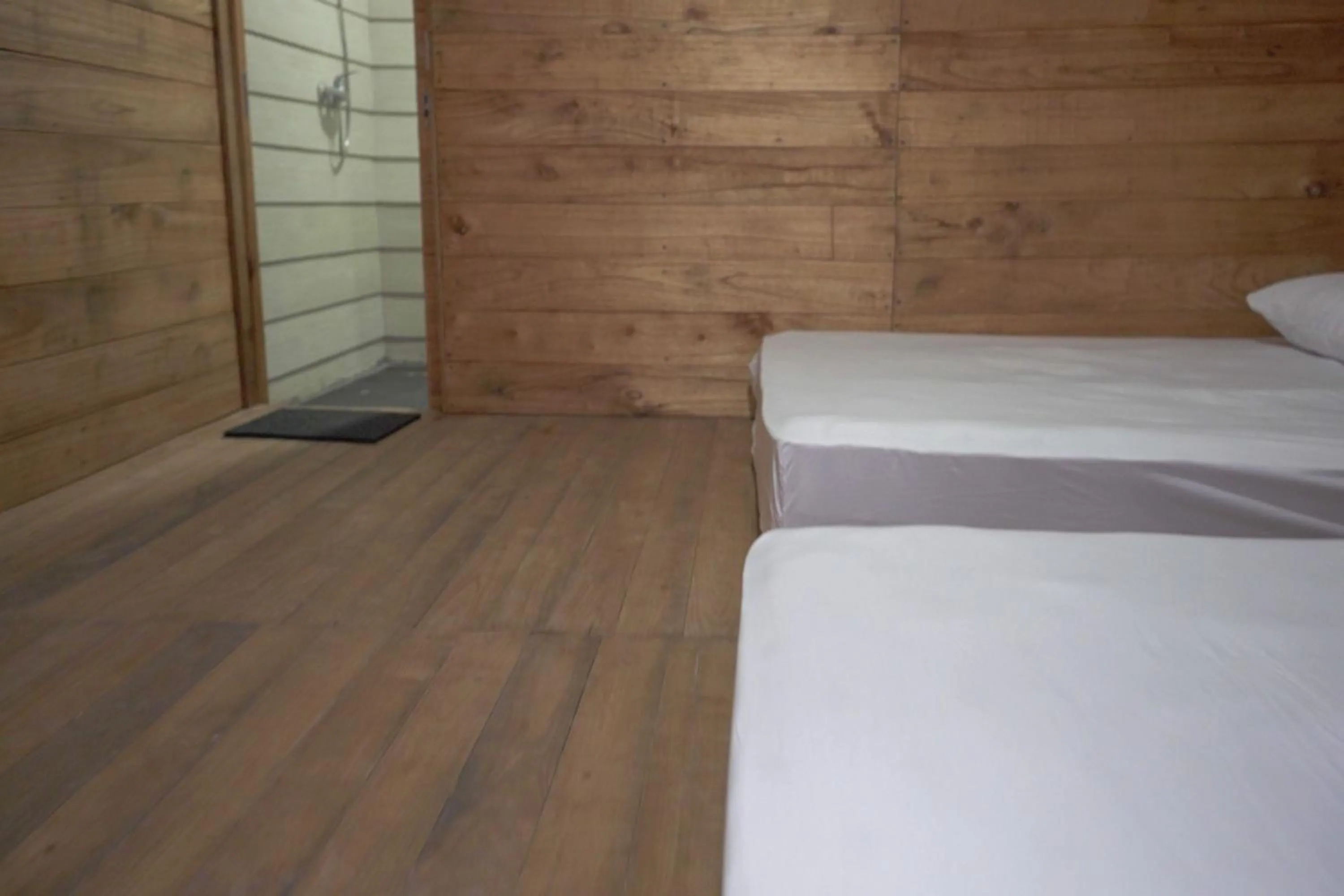 Bedroom in Pulau Mahitam Resort & Cottage by Hotelku