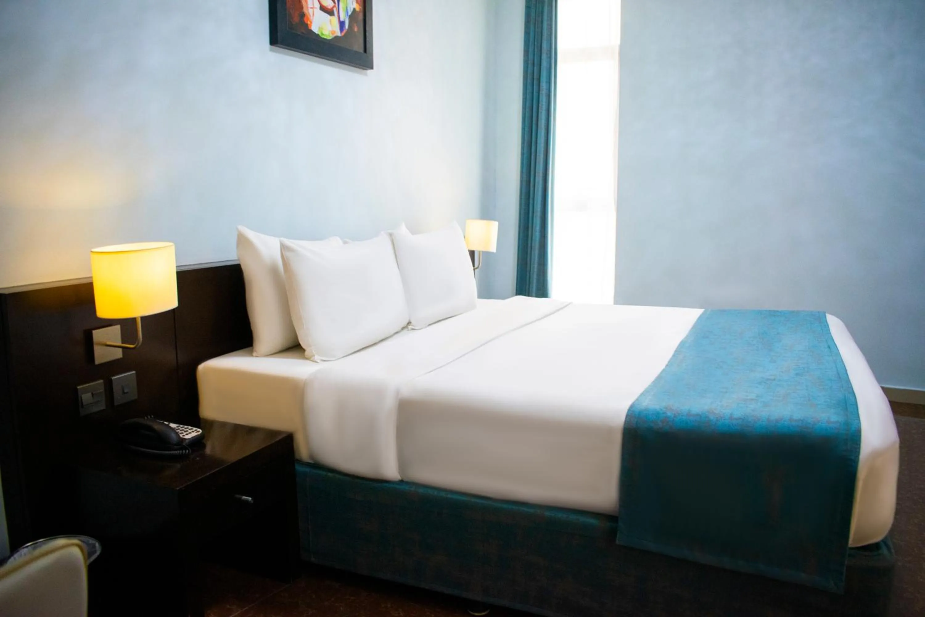 Bed in Signature Hotel Apartments and Spa