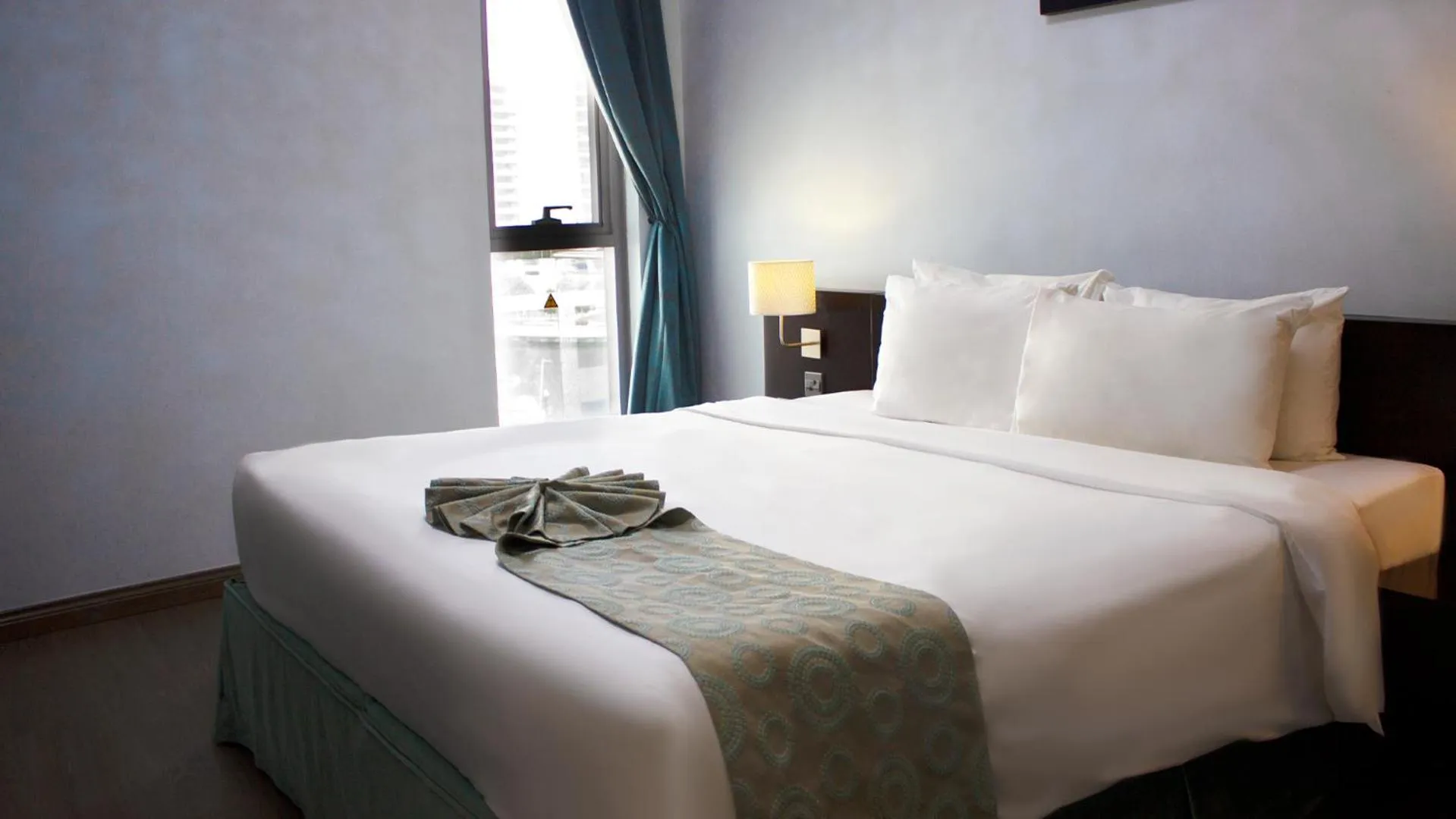 Bed in Signature Hotel Apartments and Spa