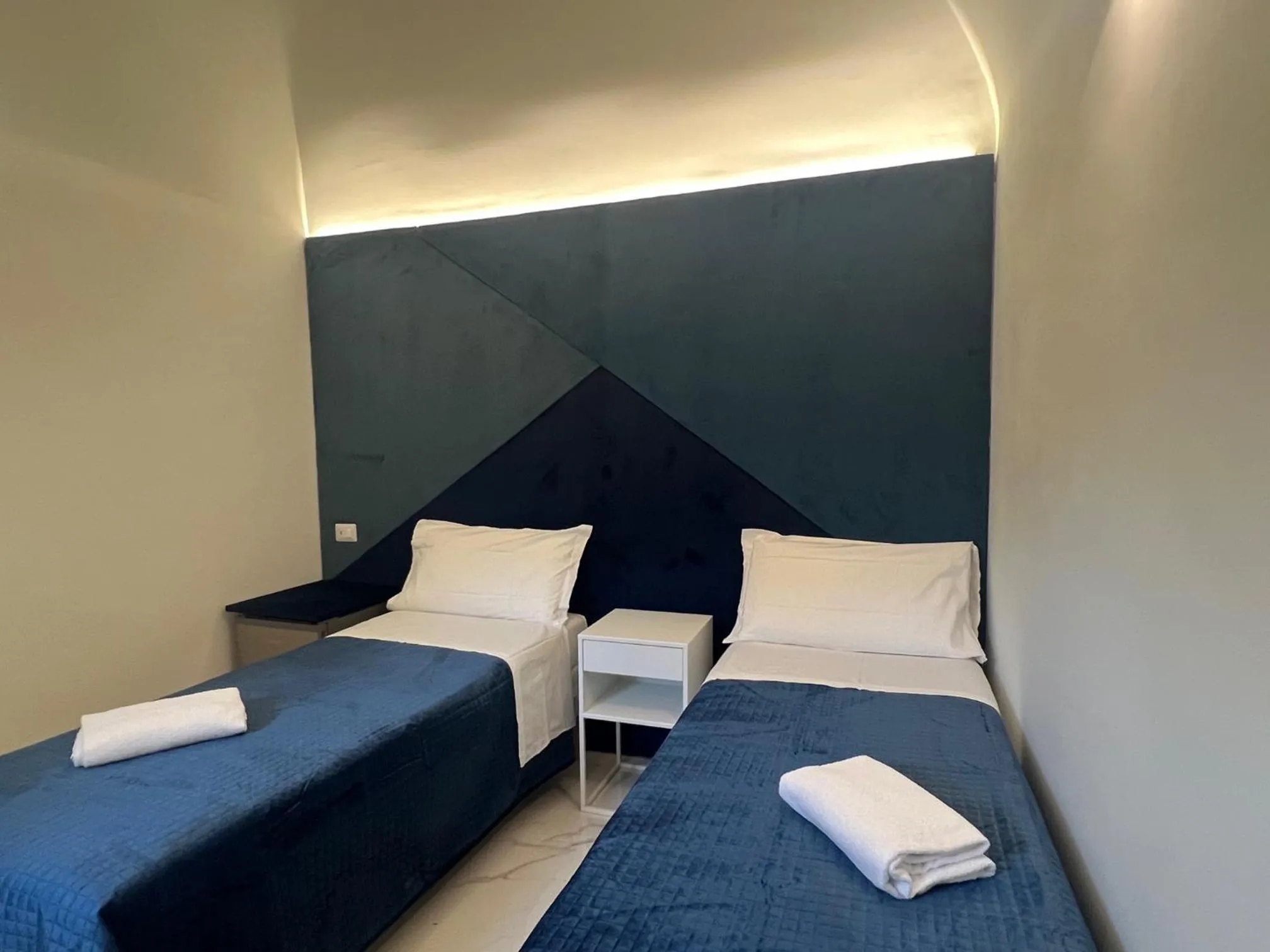 Bed in Motta Palace Apartments & Rooms