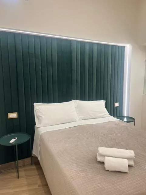 Bed in Motta Palace Apartments & Rooms