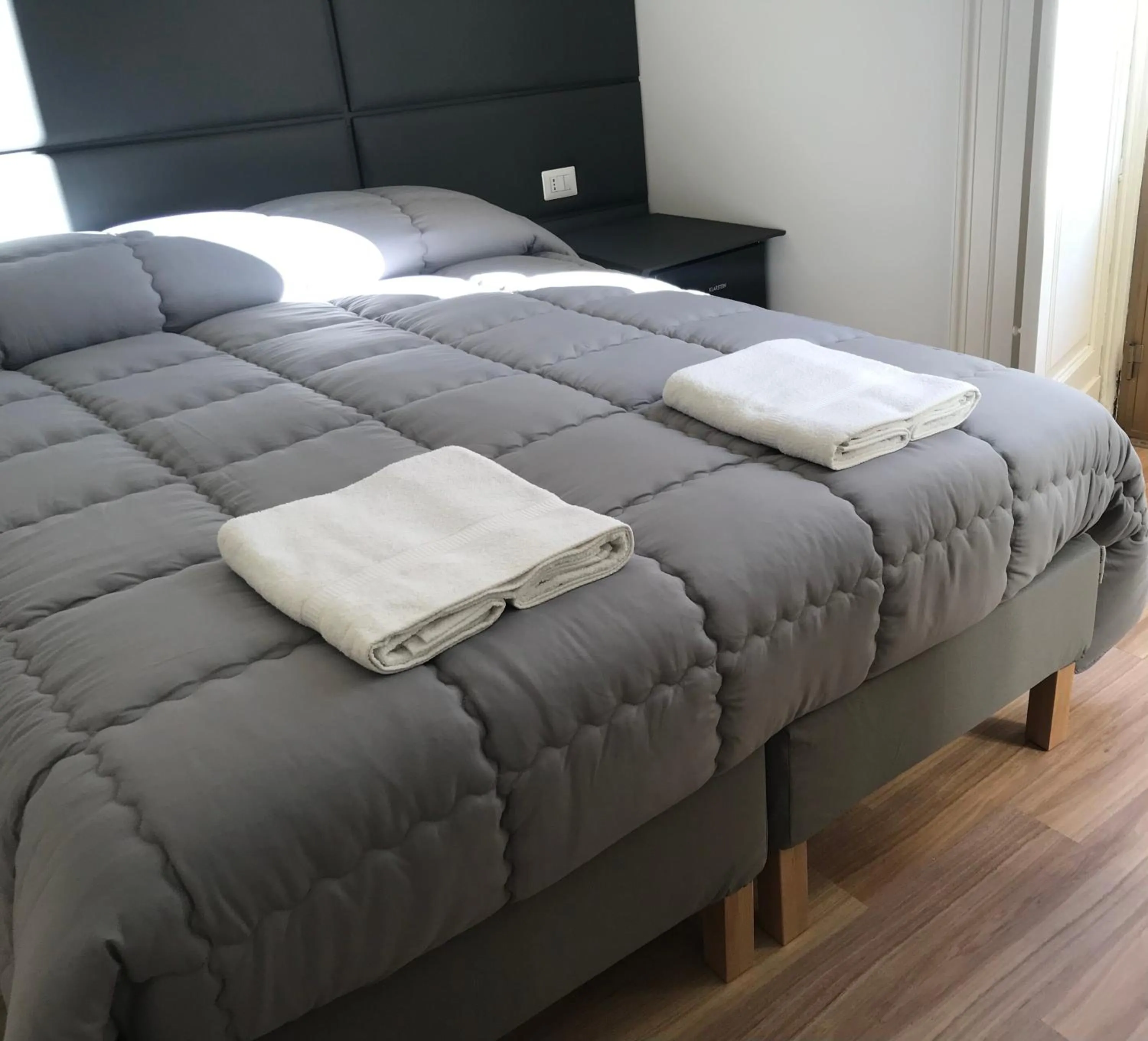 Bed in Motta Palace Apartments & Rooms