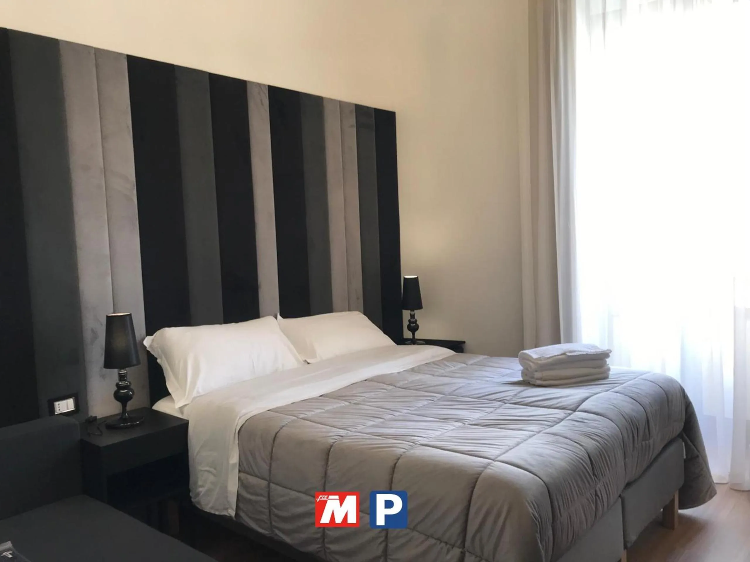 Bedroom, Bed in Motta Palace Apartments & Rooms