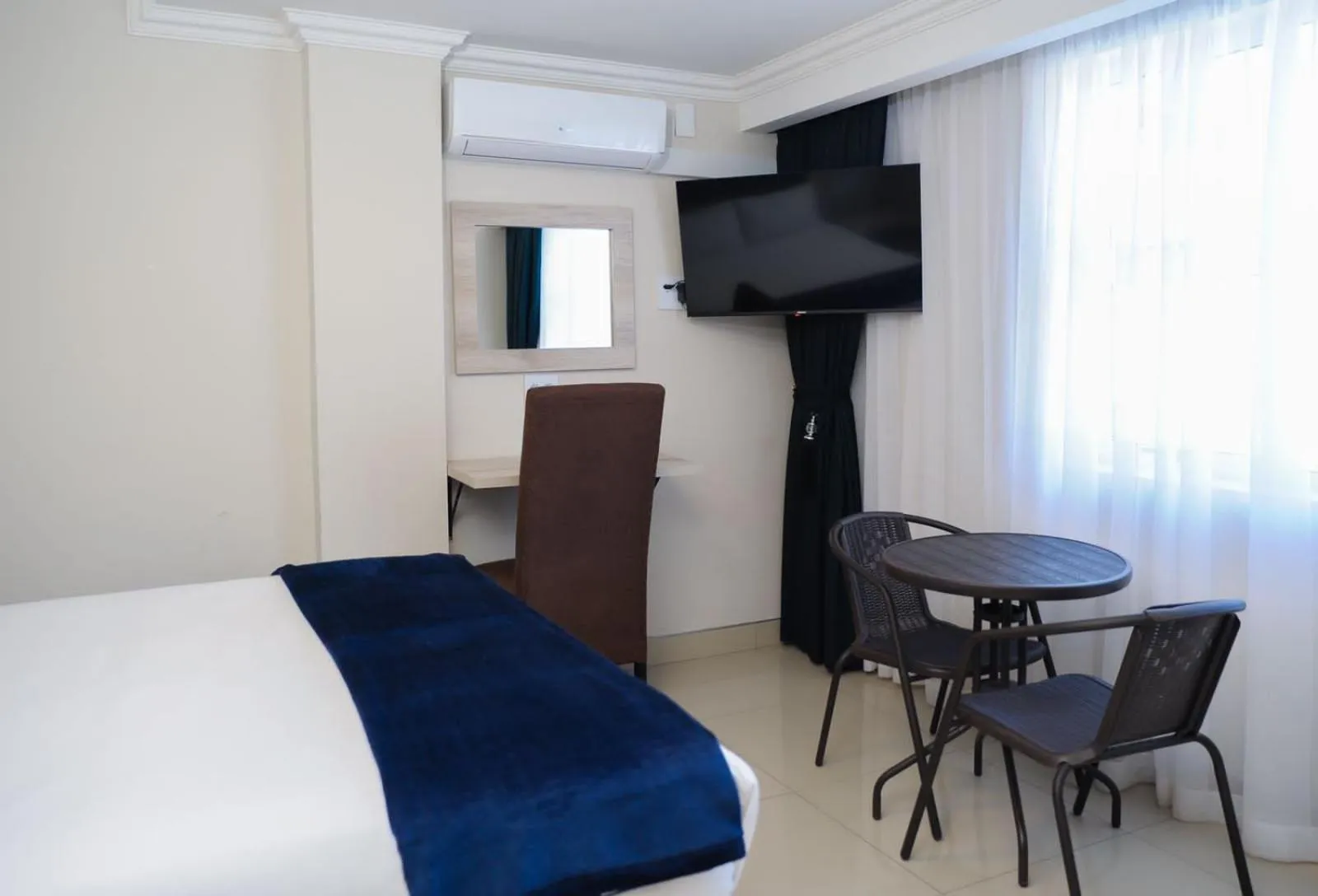 Bed in Bayside Taj Hotel