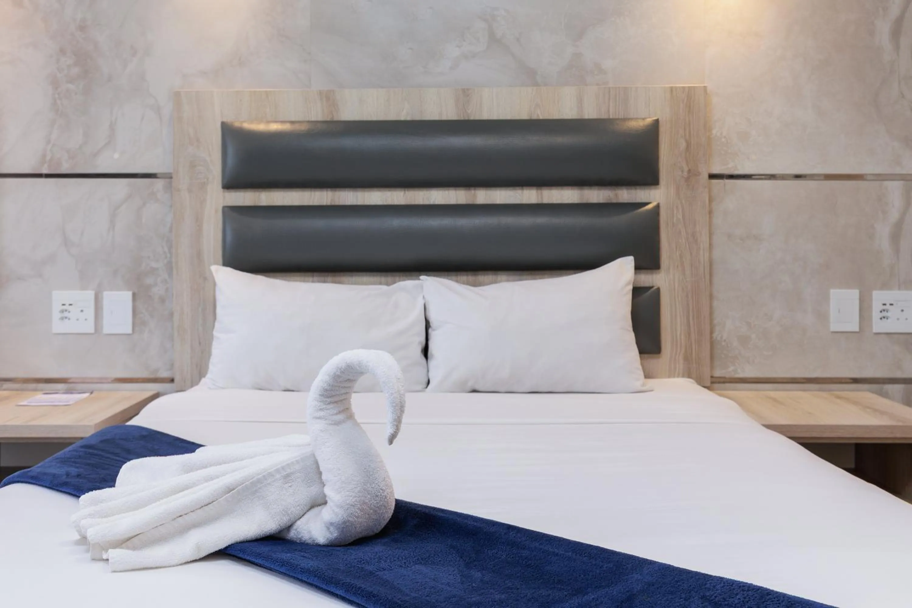 Bed in Bayside Taj Hotel