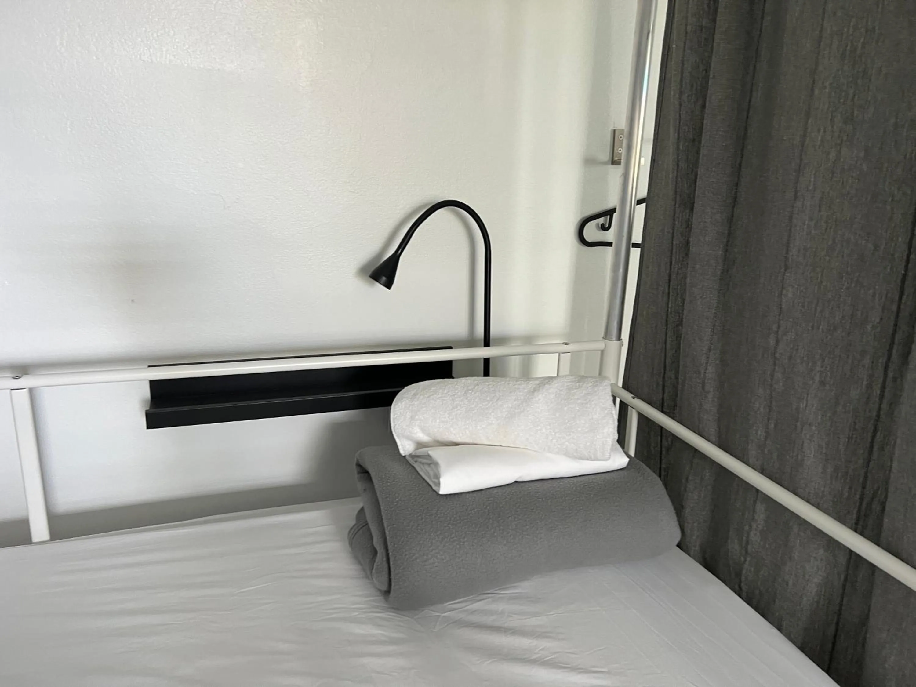 towels, Bed in Nomada Beach Hostel- Isla Verde