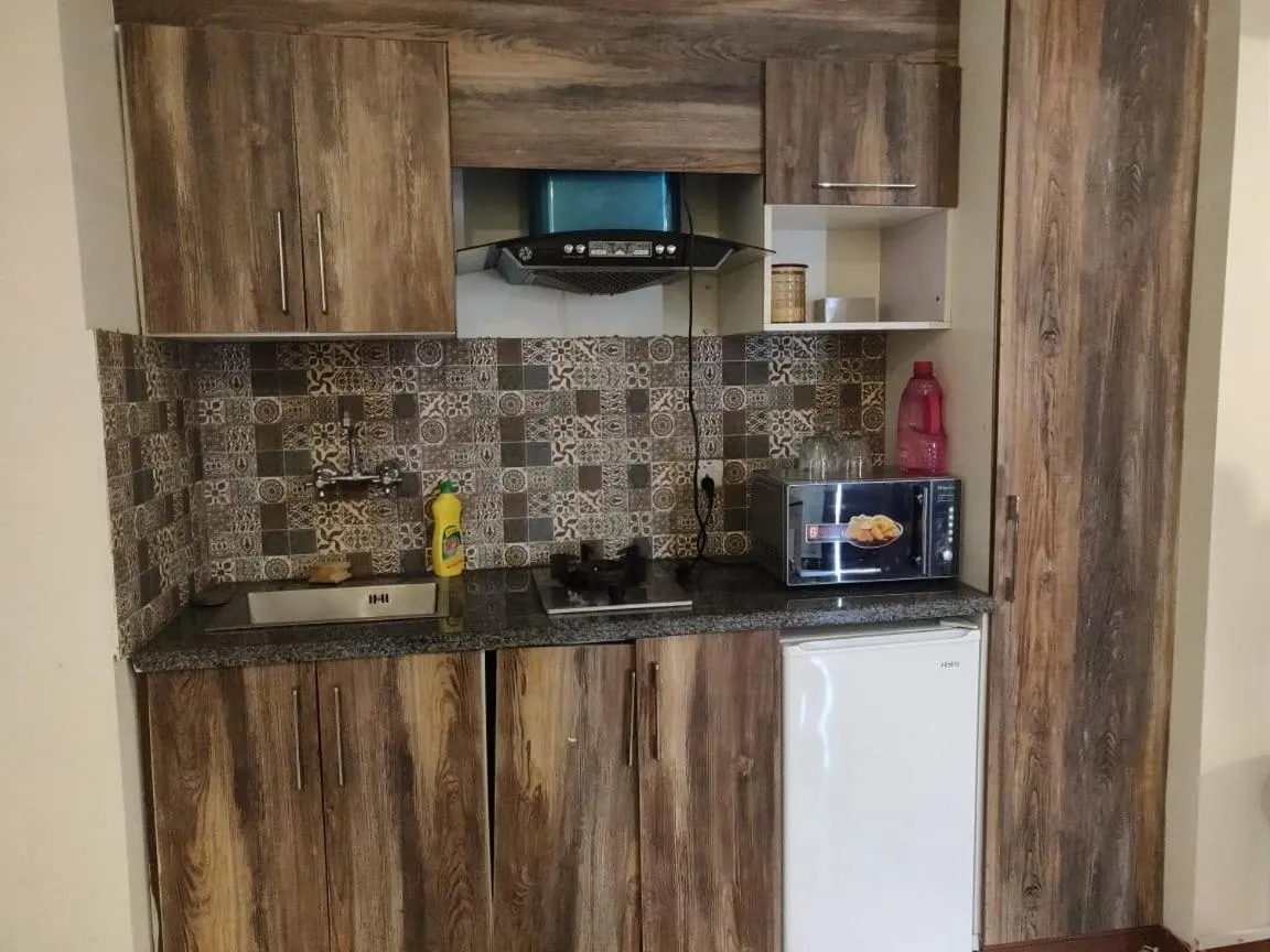 Kitchen or kitchenette in Comfyinn Guest House