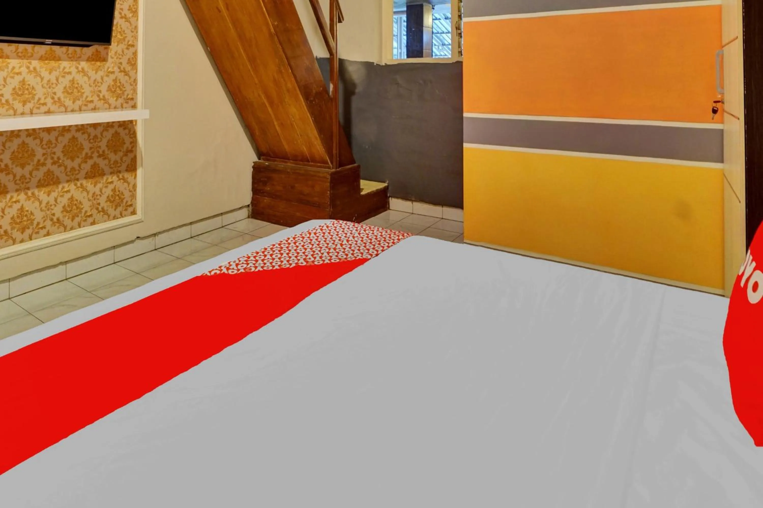 Bedroom in Hotel O Btc Guest House Syariah