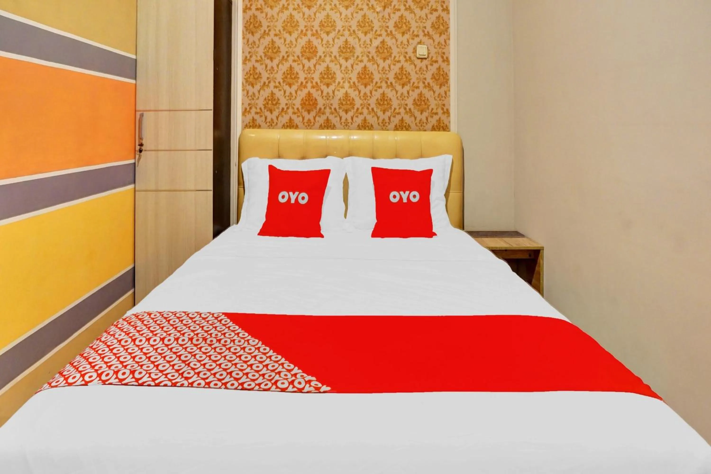 Bedroom in Hotel O Btc Guest House Syariah