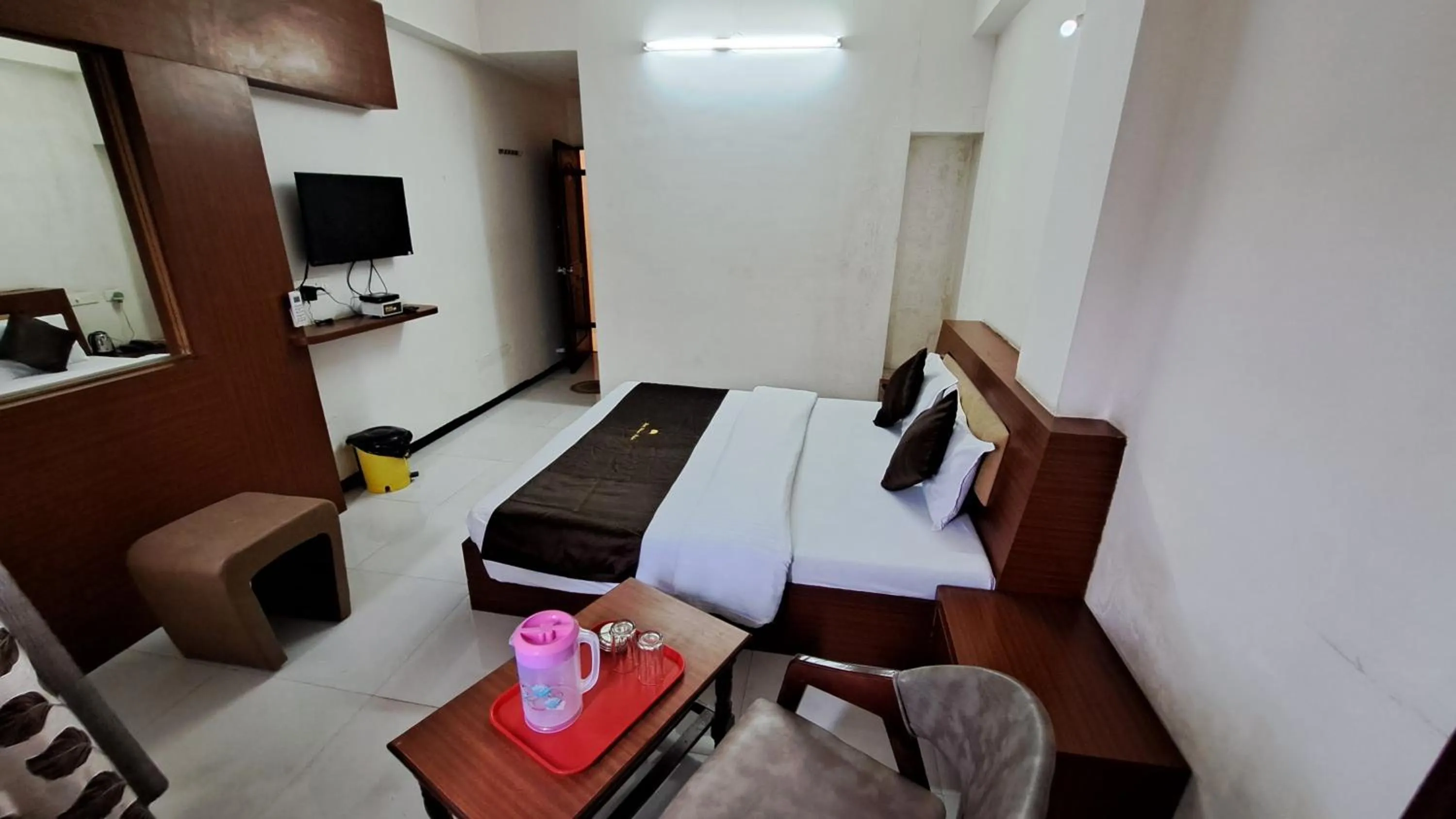 Bed in Hotel Dhruv Palace