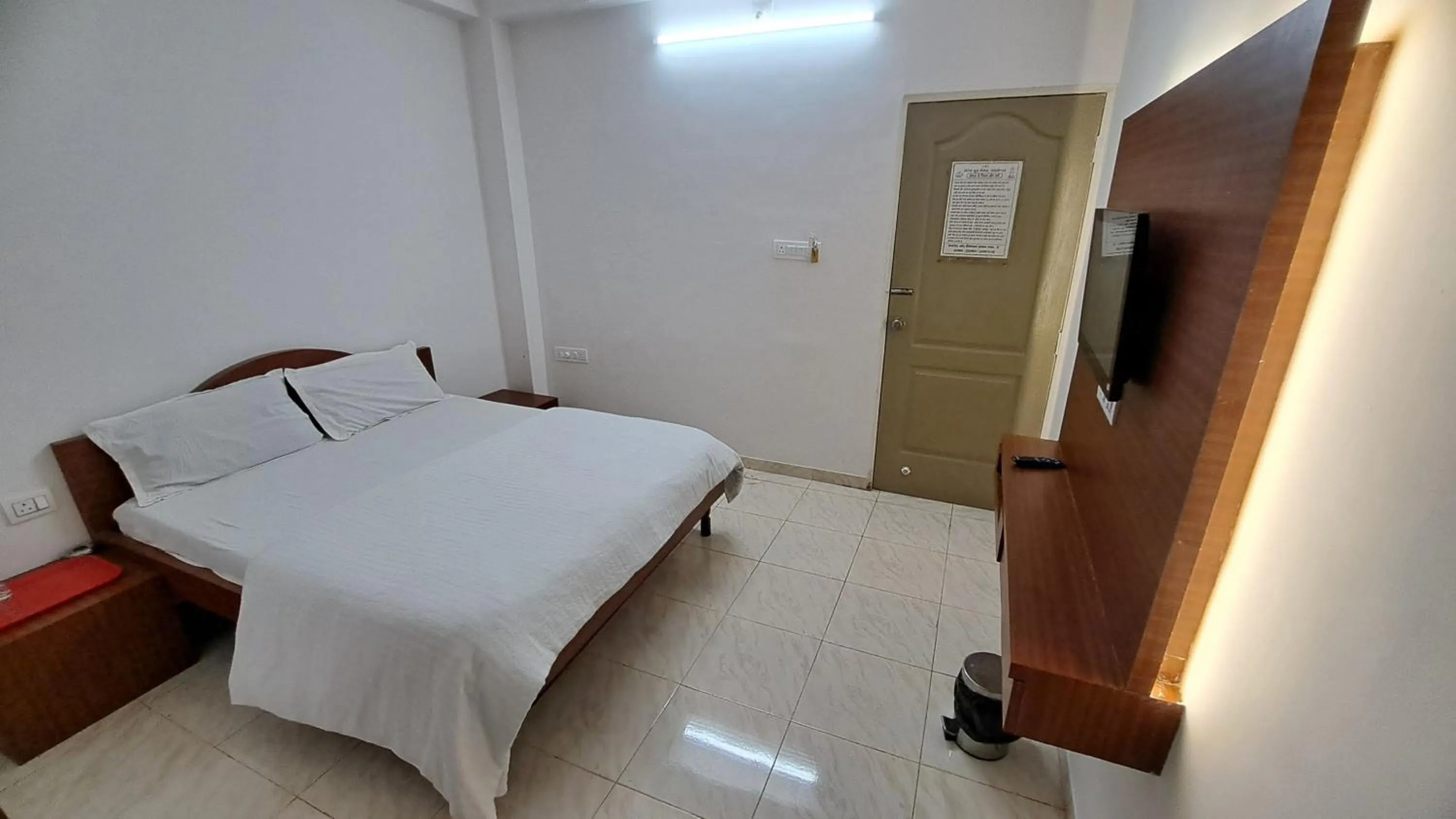 Bed in Hotel Dhruv Palace