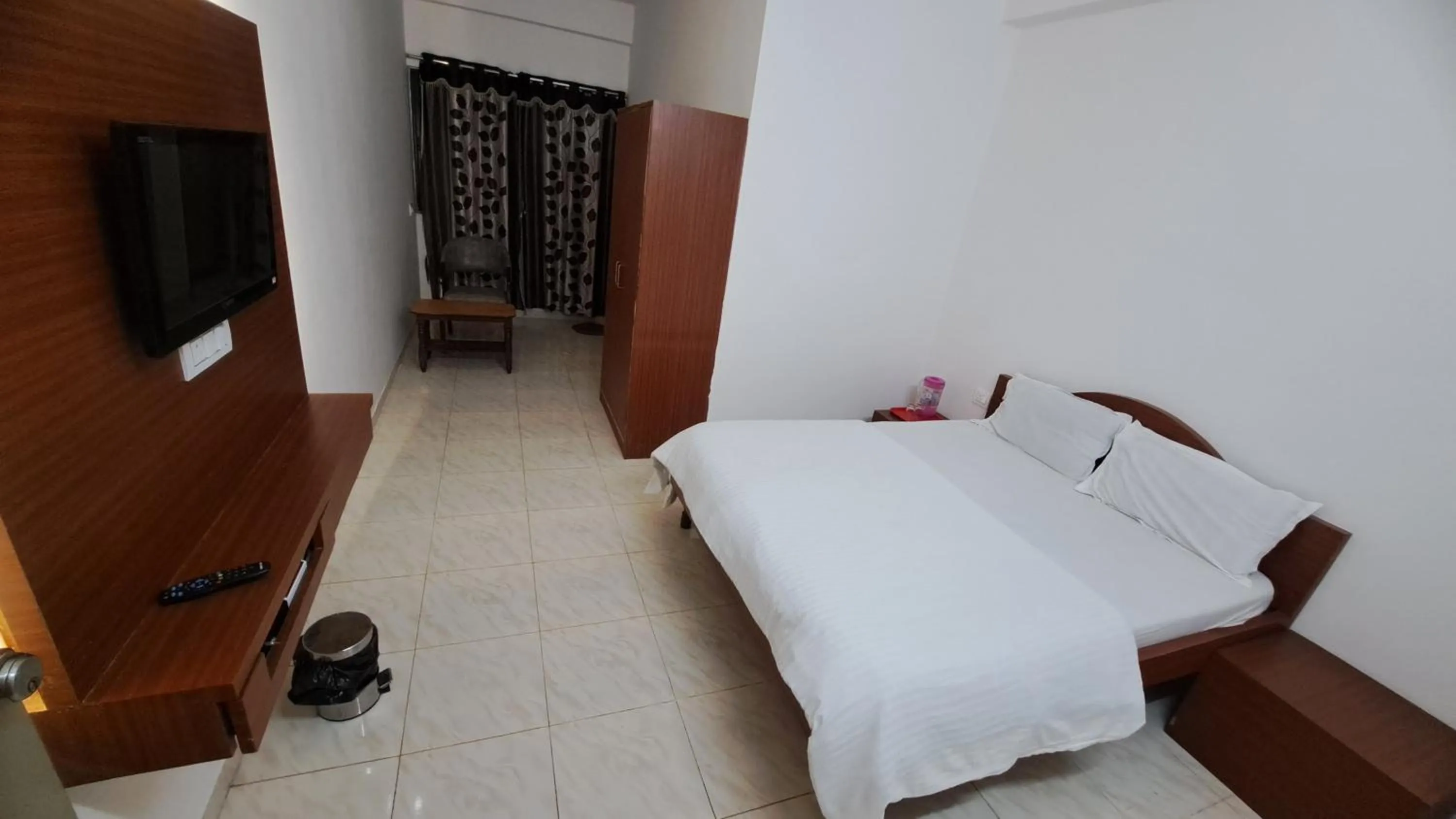 Bed in Hotel Dhruv Palace