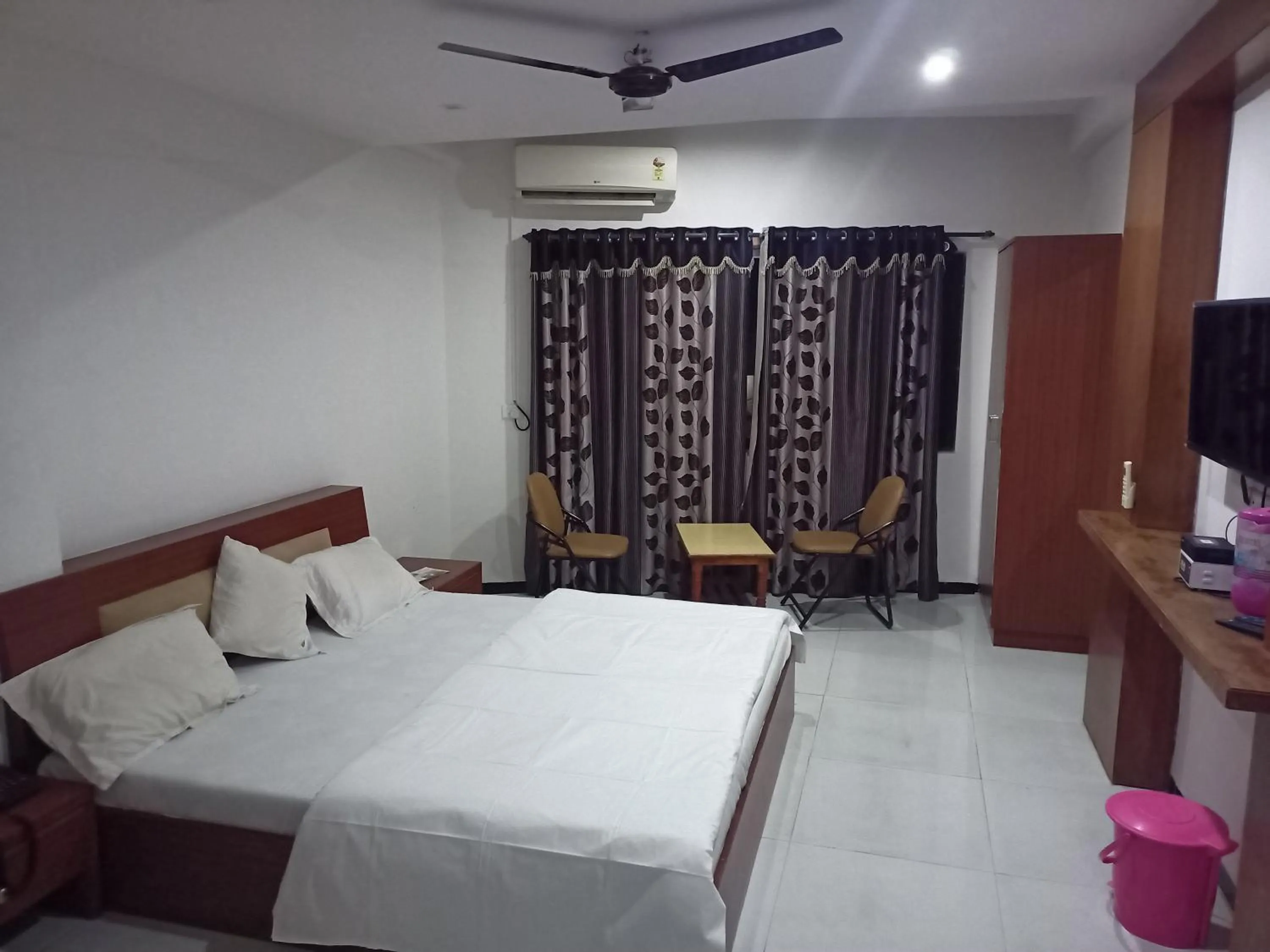 Bed in Hotel Dhruv Palace