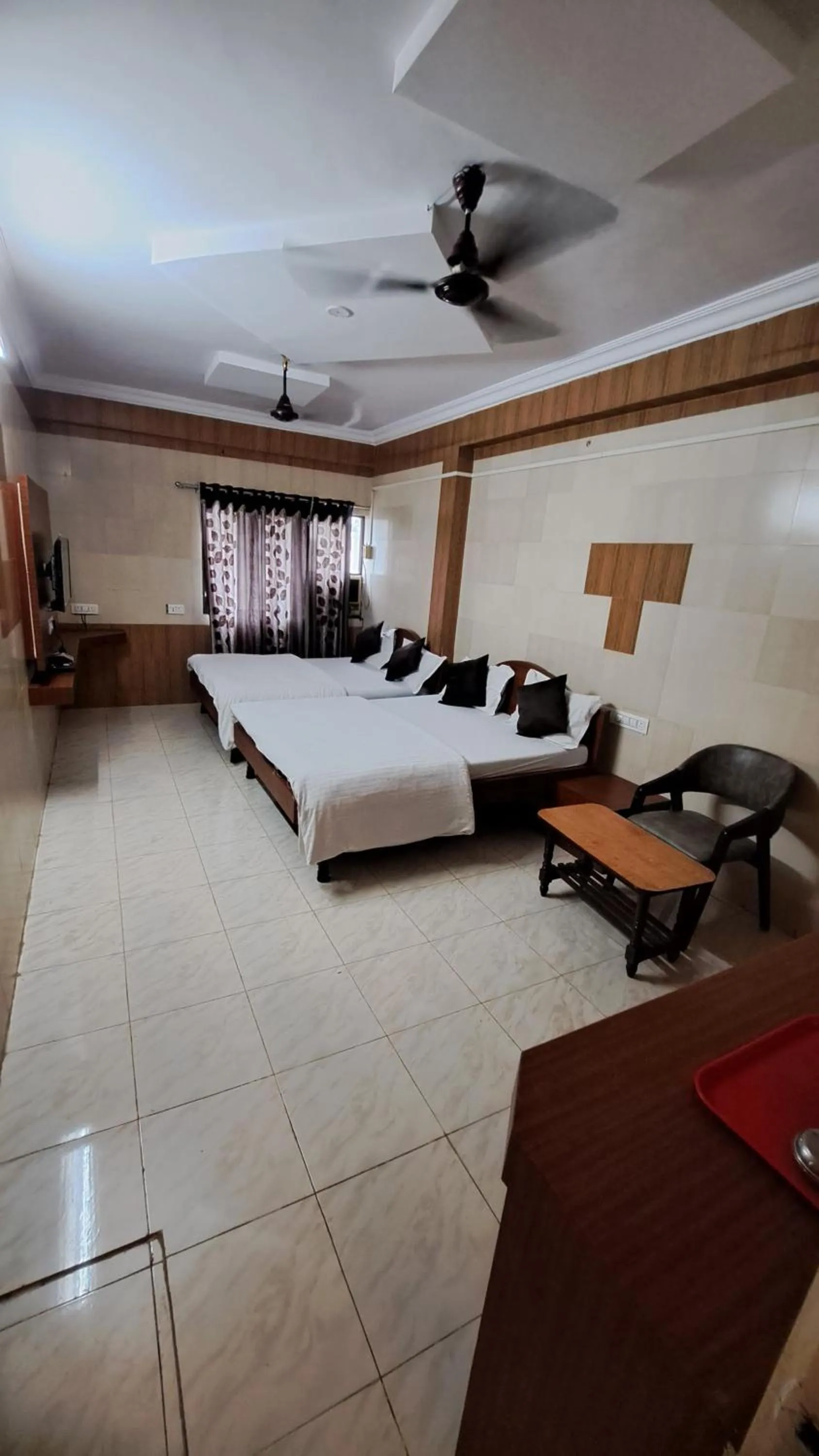 Bed in Hotel Dhruv Palace