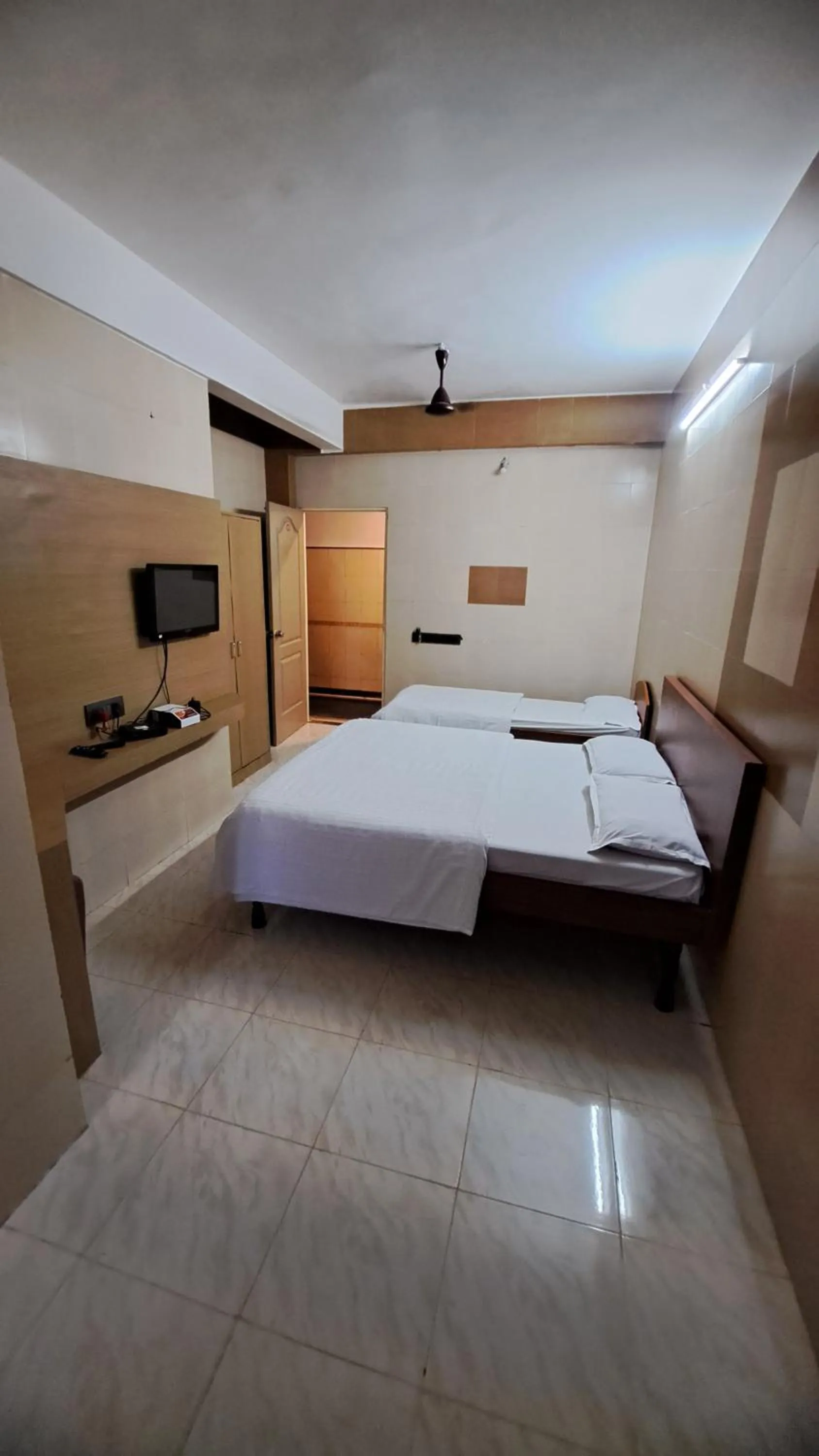 Bed in Hotel Dhruv Palace