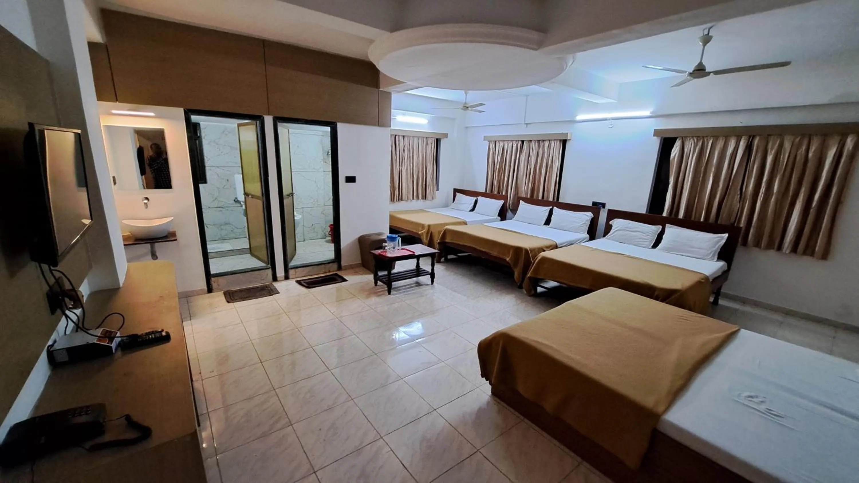 Bed in Hotel Dhruv Palace