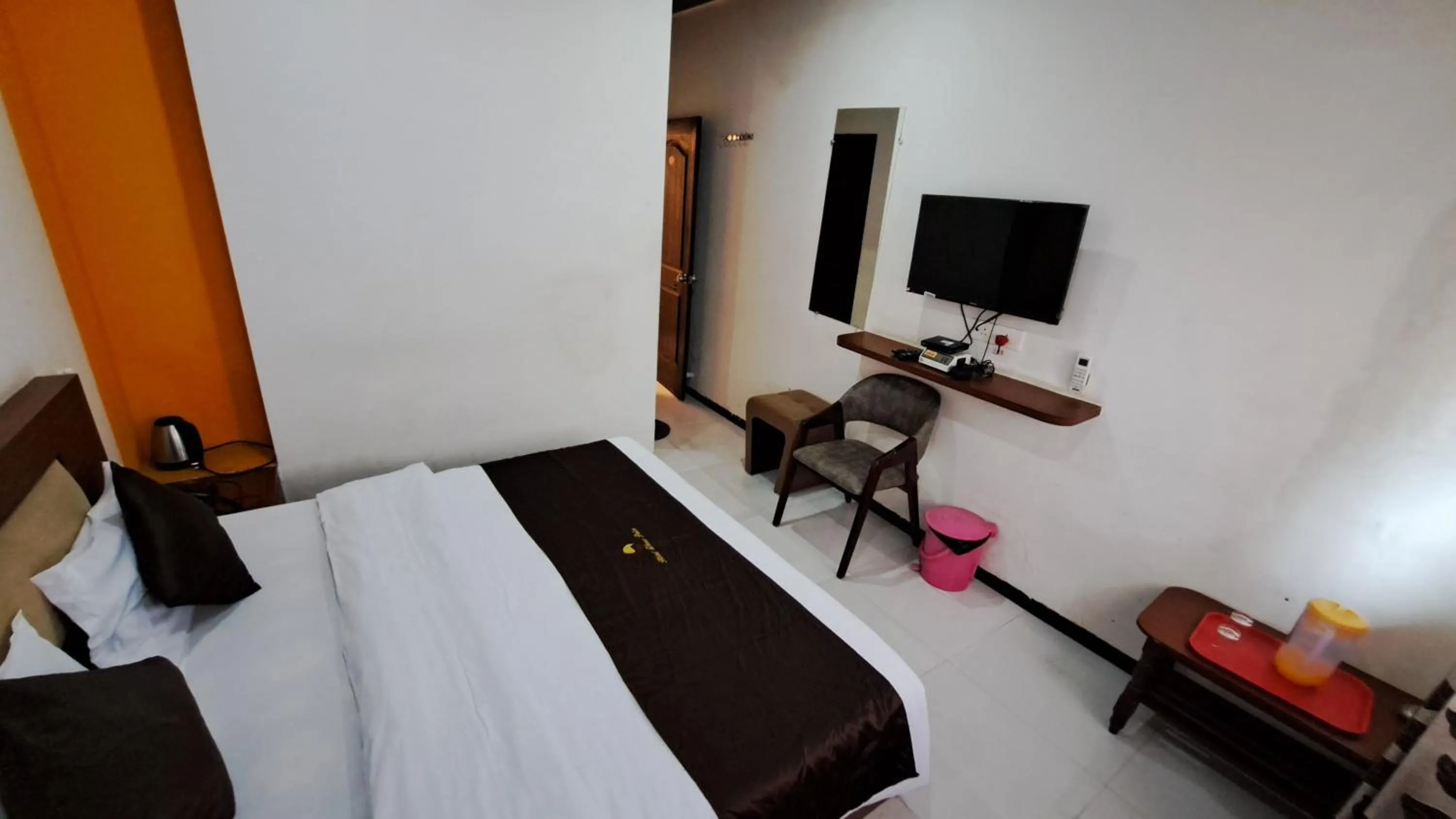 Bed in Hotel Dhruv Palace