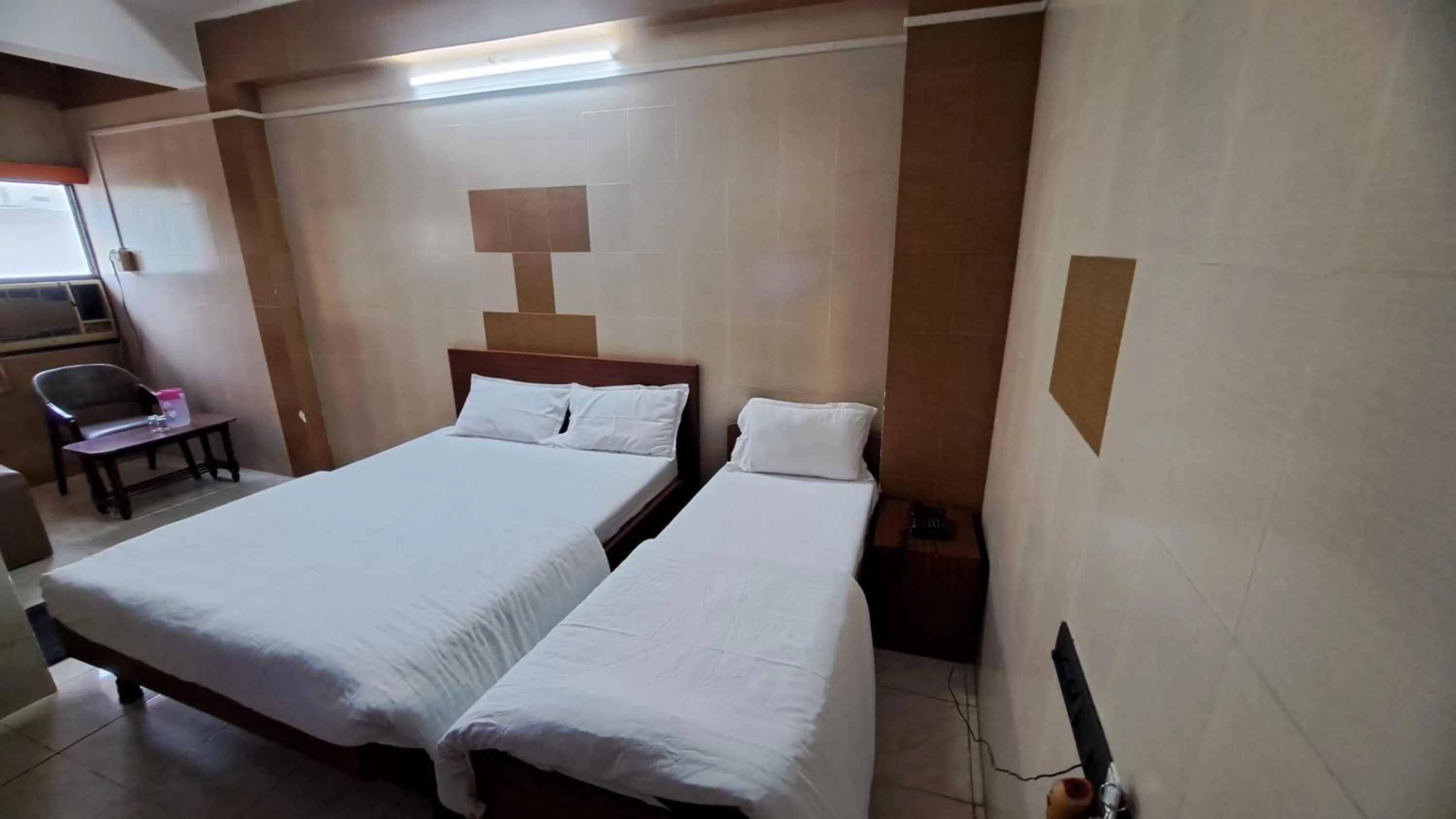 Bed in Hotel Dhruv Palace