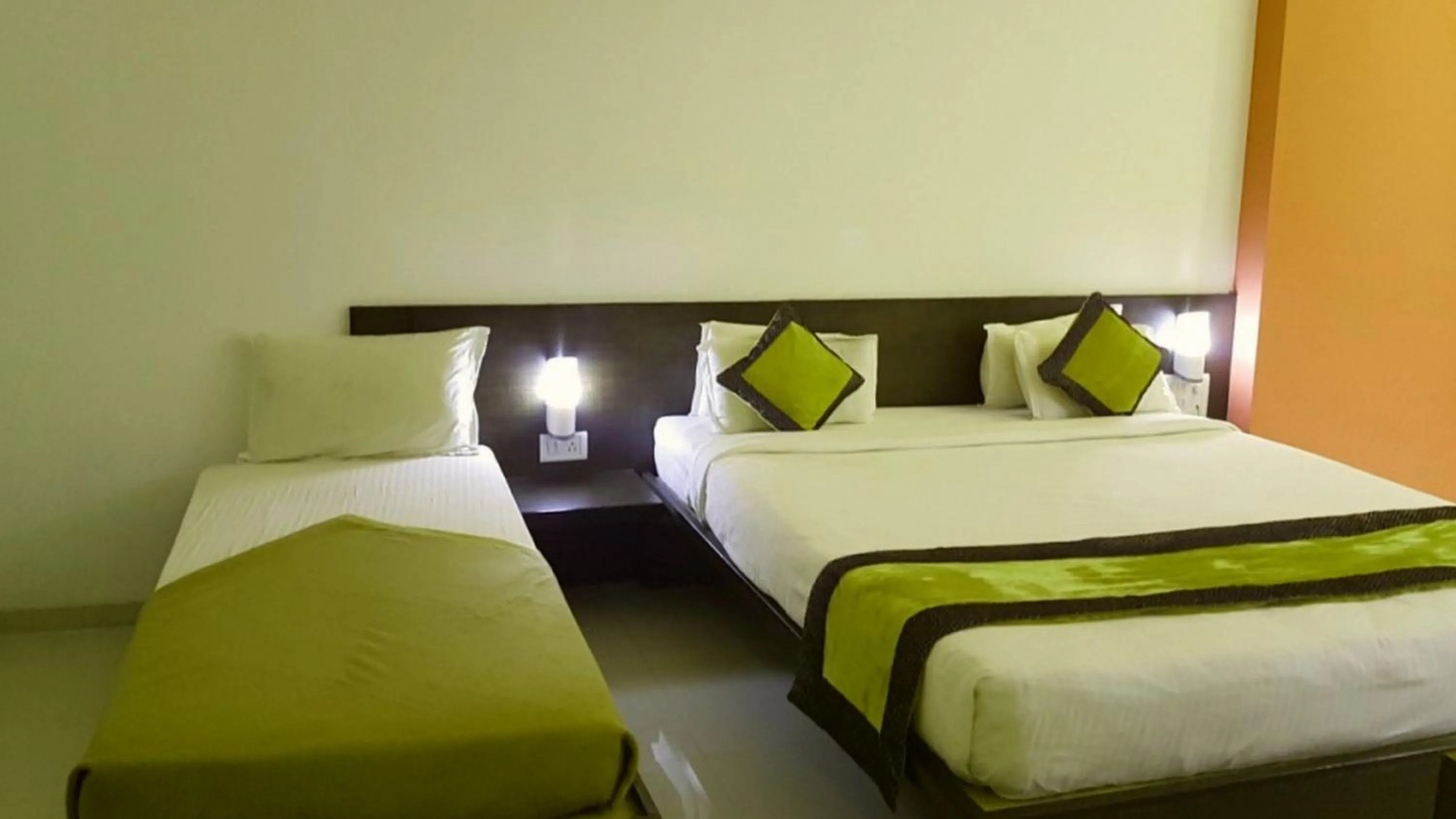 Bed in HOTEL SAI NISARG