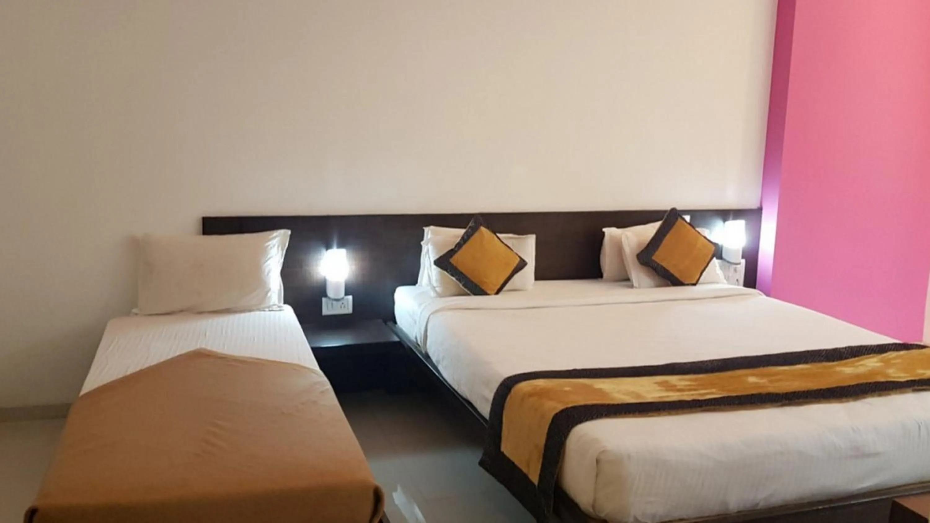 Bed in HOTEL SAI NISARG