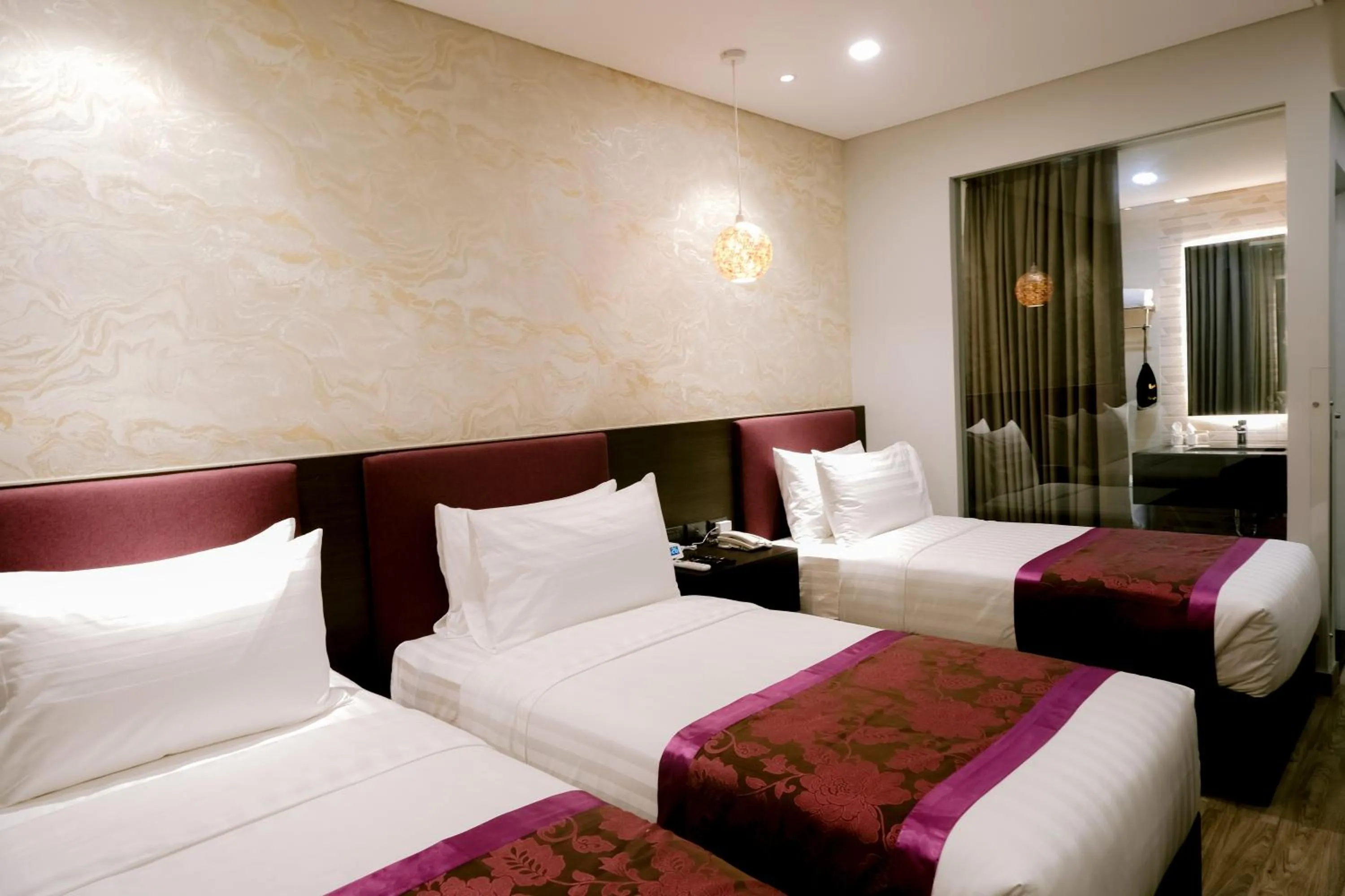 Bed in Goldberry Suites and Hotel Cebu