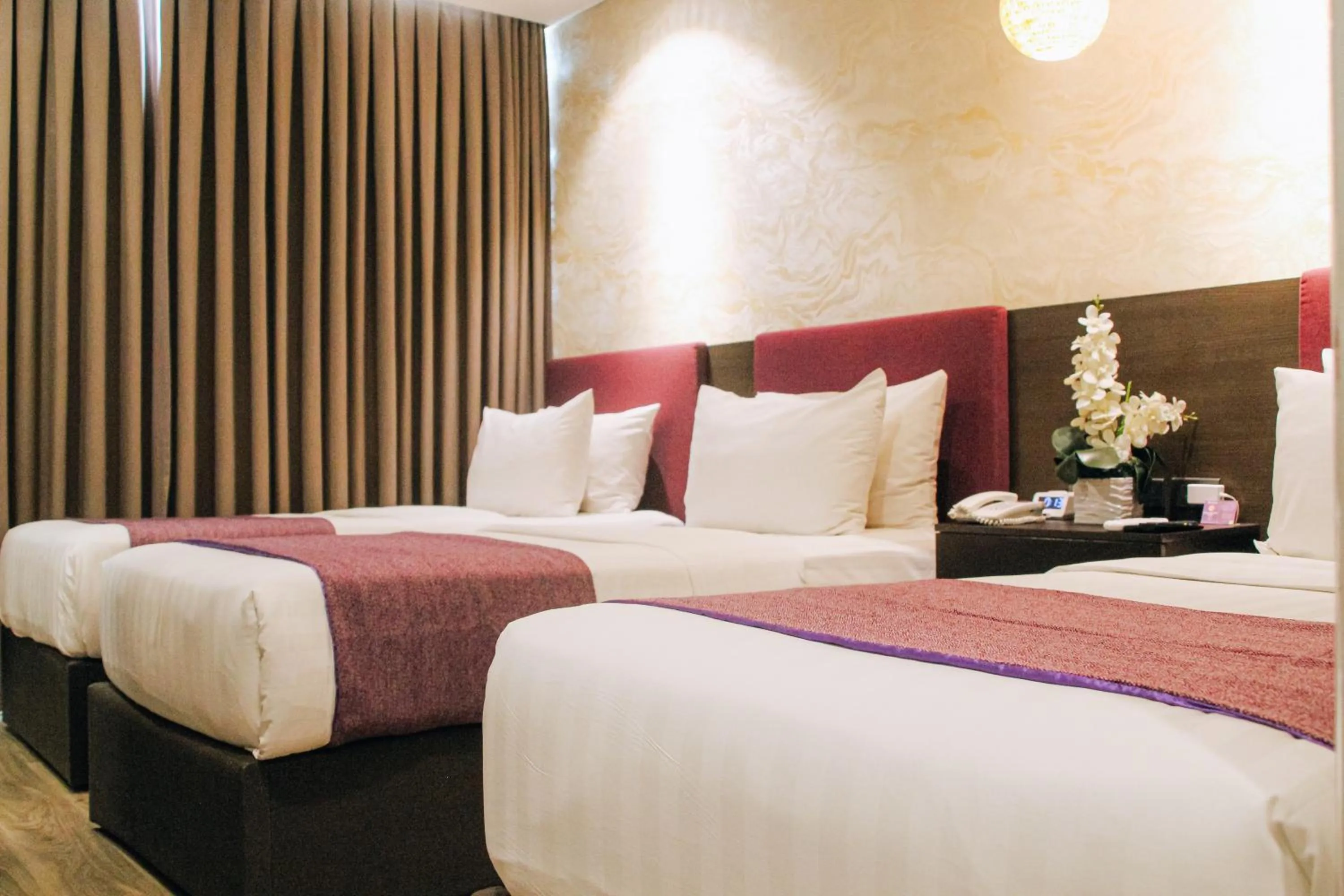 Bed in Goldberry Suites and Hotel Cebu
