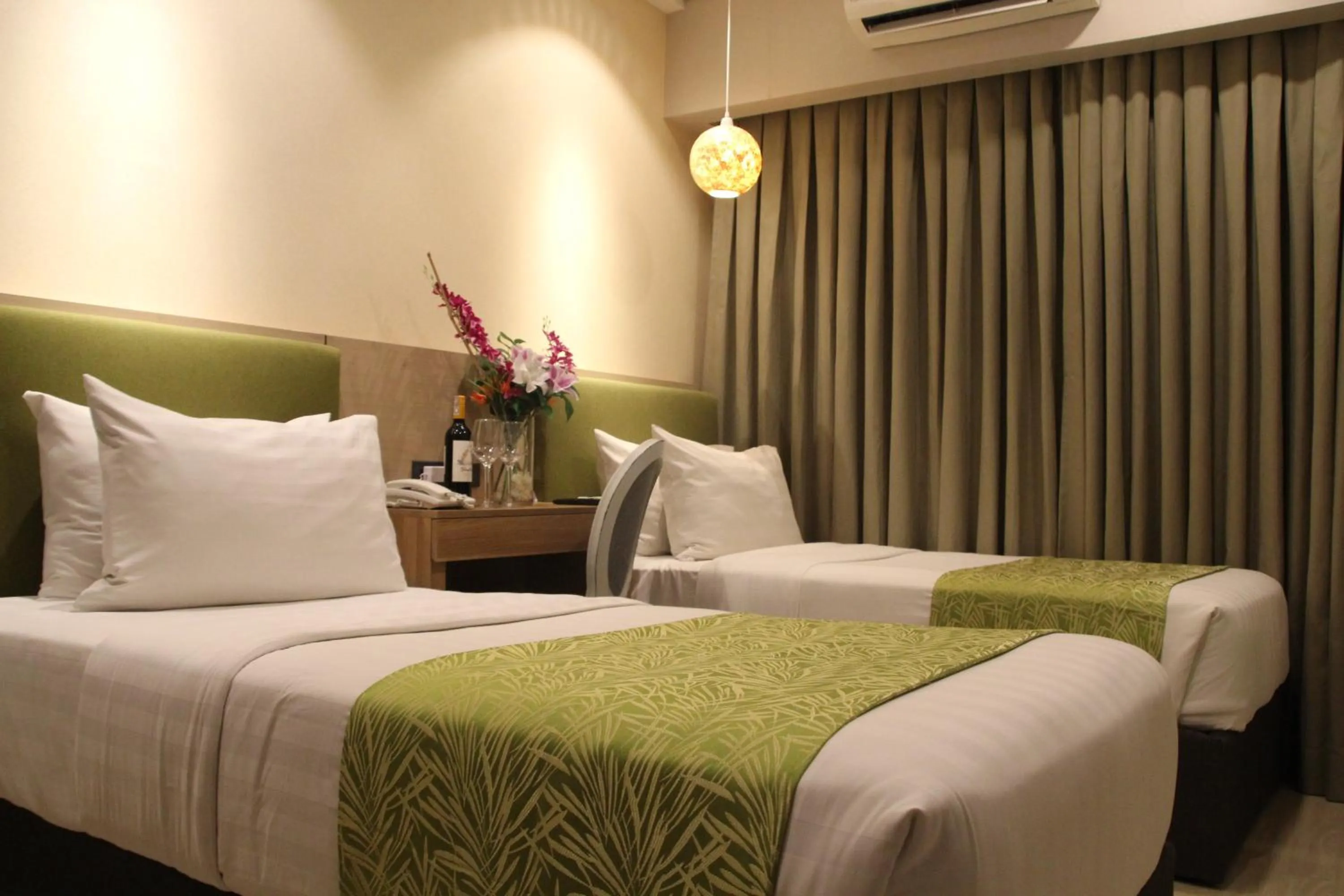 Bed in Goldberry Suites and Hotel Cebu